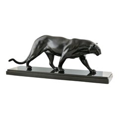 Art Deco panther sculpture by Rulas on black marble base, France 1930.
