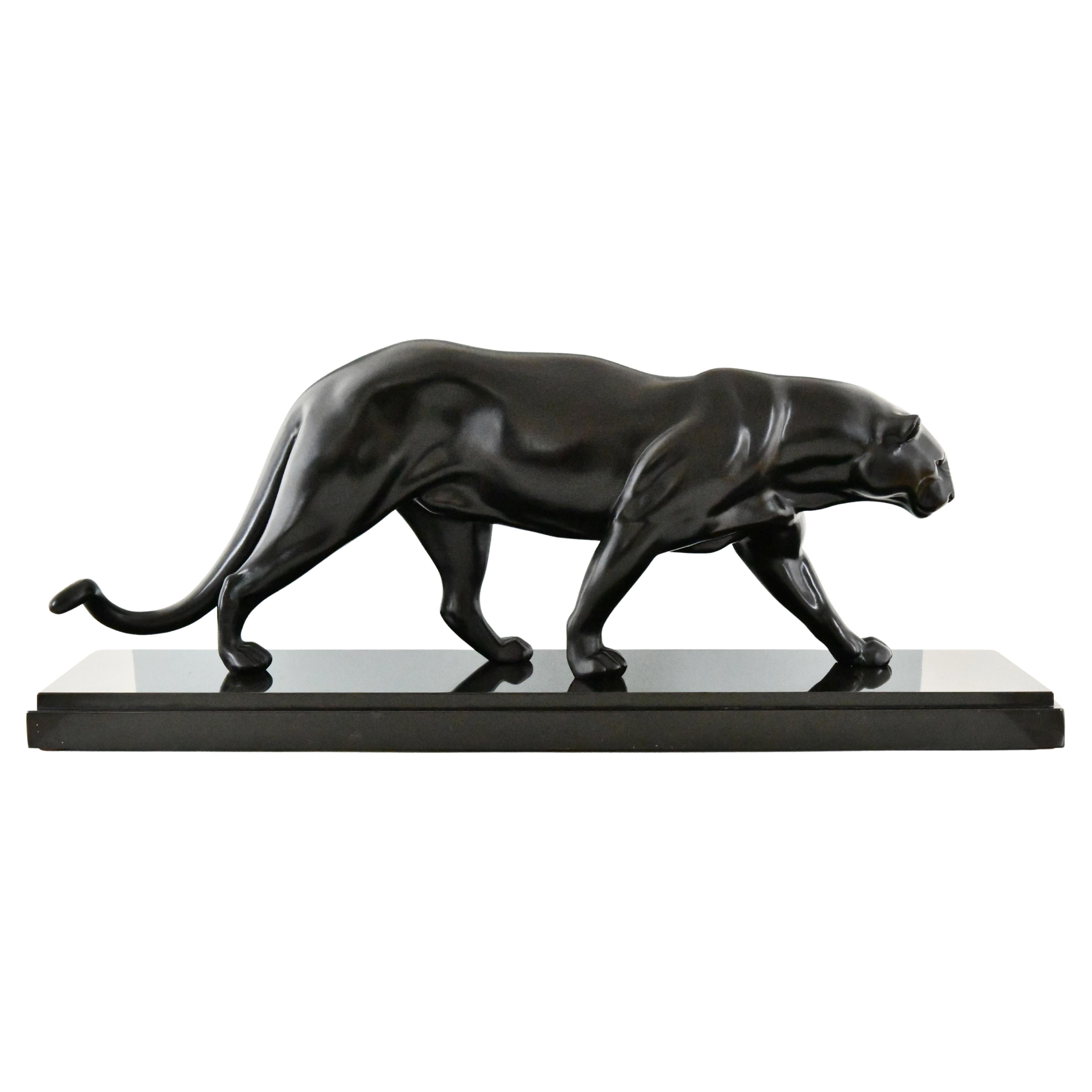 Art Deco panther sculpture by Rulas on black marble base, France 1930.
