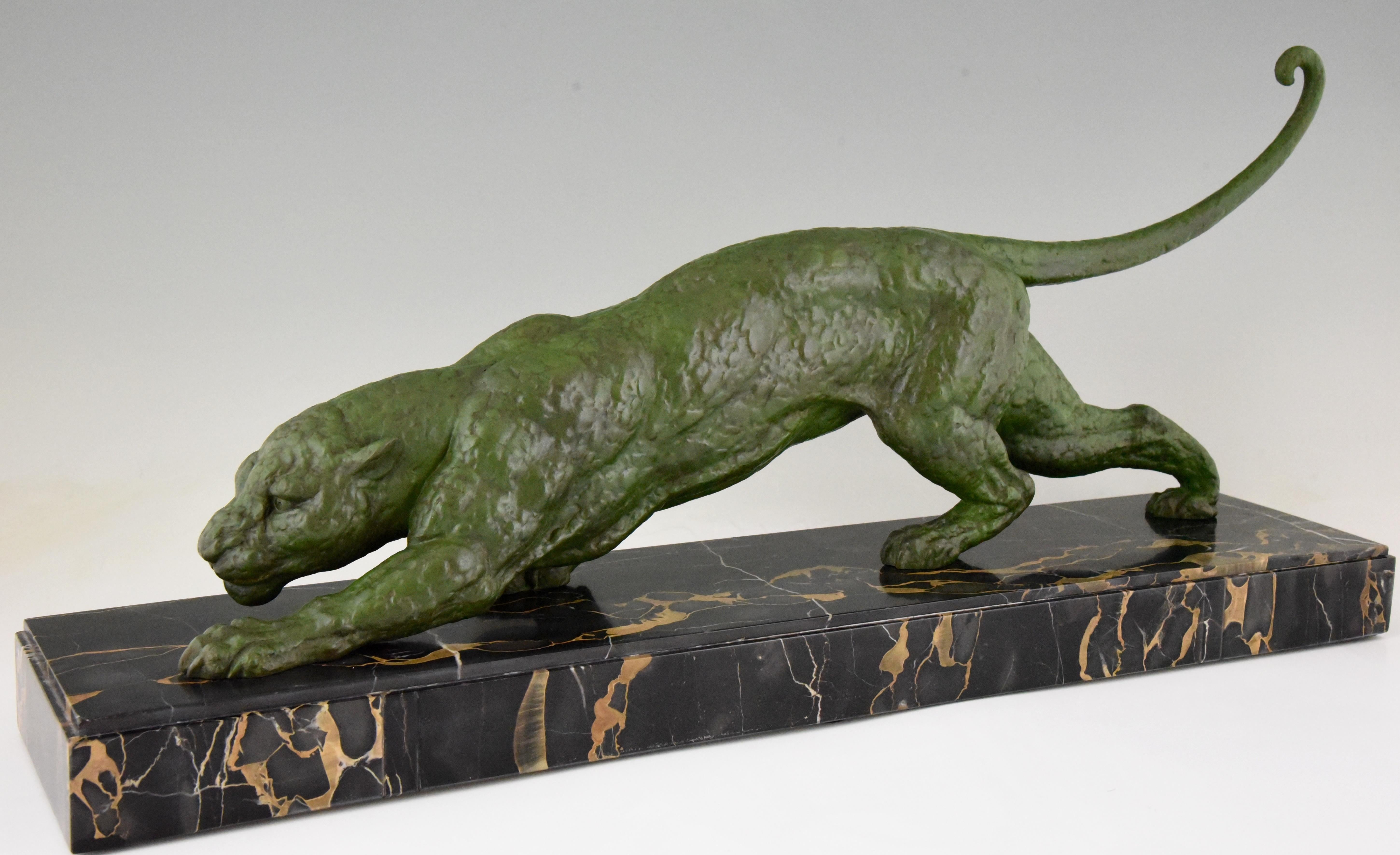 Large Art Deco sculpture of a panther by the famous sculptor Demetre H. Chiparus. The Art metal sculpture has a beautiful green patina and stands on a Portor marble base, France, 1930. 

“Art deco and other figures” by Brian Catley.?“Art deco
