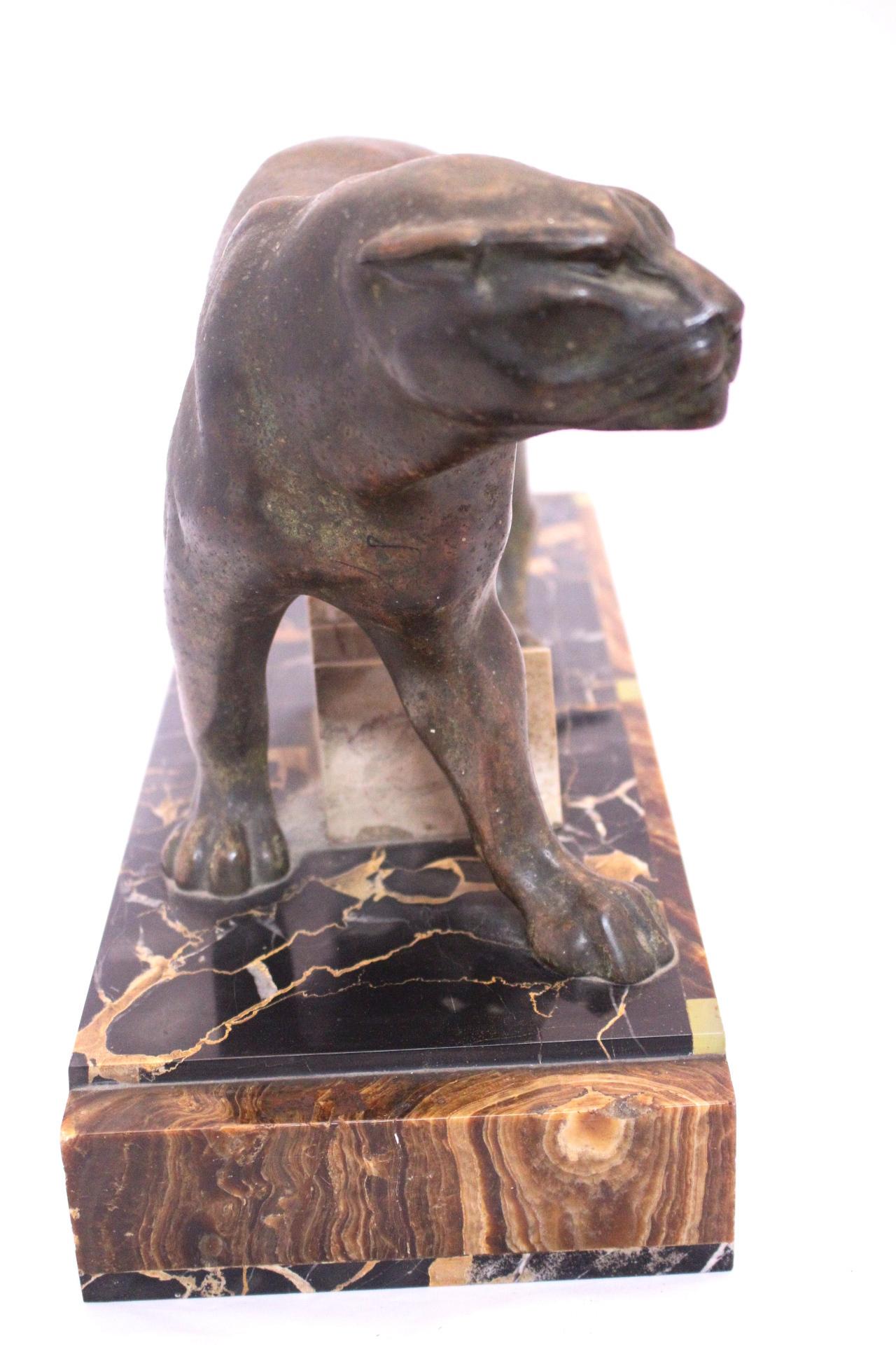 An Art Deco patinated spelter study of a prowling panther, mounted on a marble base. 
Good vintage condition with usual signs of wear for its age.
   