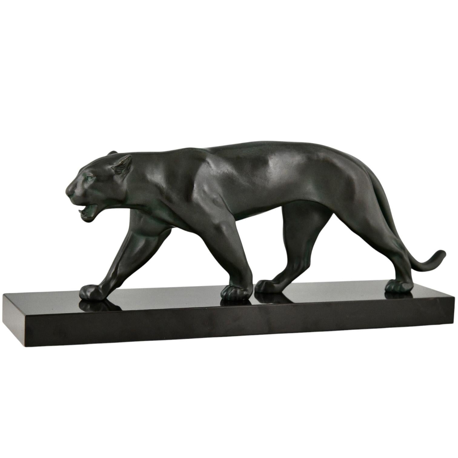 Art Deco panther sculpture OUGANDA by Max Le Verrier.
Signed M. Le Verrier 
France 1930 original cast of the Art Deco period.
Patinated Art Metal - very dark green patina- on black marble base. 
With Certificate of Authenticity.

This sculpture is