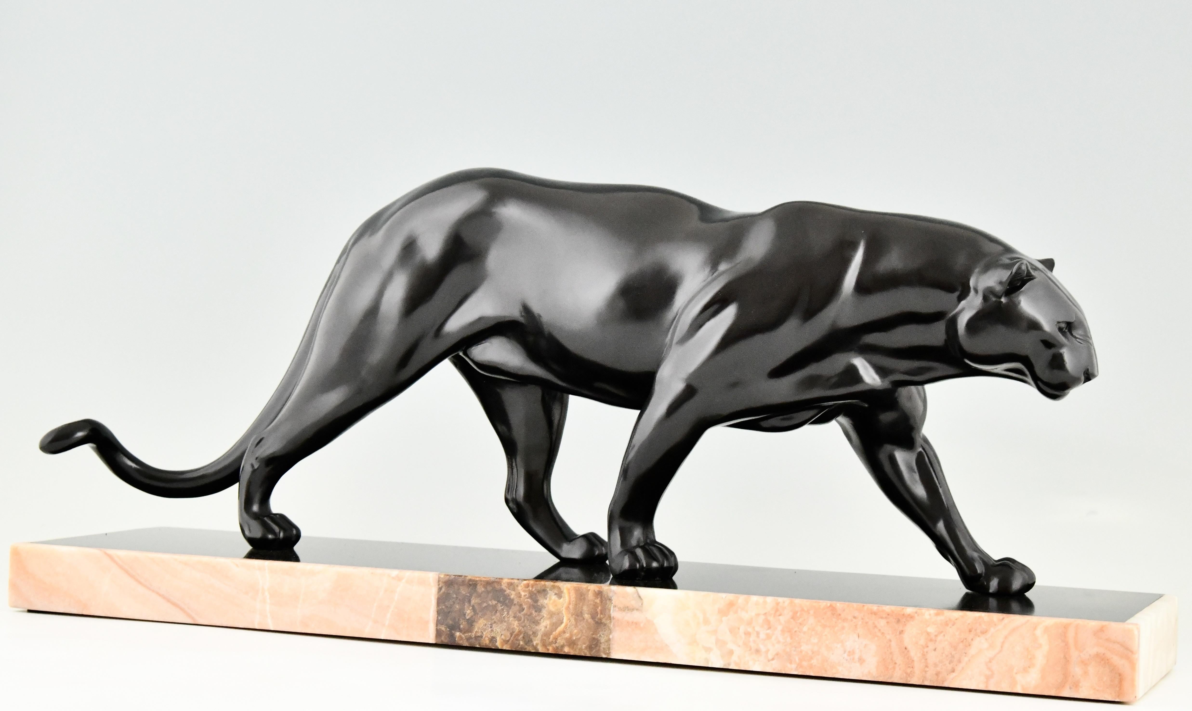 Beautiful and impressive Art Deco sculpture of a walking panther by the French artist Rulas, art metal with black patina on a Belgian Black marble base with inlay. Ca. 1930.
  
