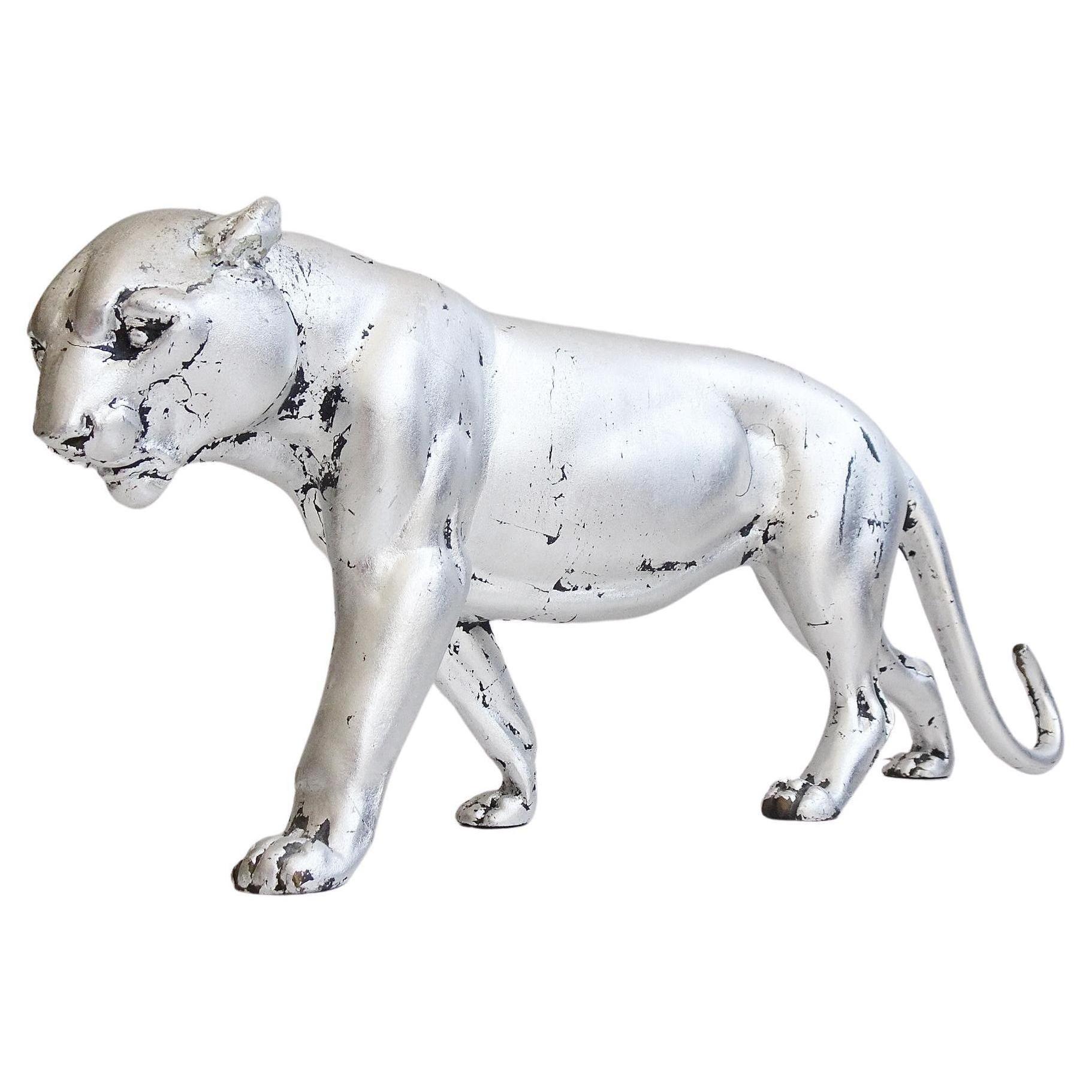 This silver leaf metal panther sculpture is a 1930's animal sculpture. A graceful big cat with finely crafted details that sets great accents in the living area and looks very modern.



