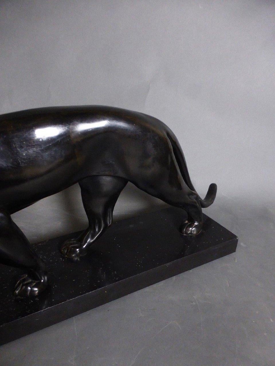 Beautiful panther in sheet metal with a nice bronze patina signed on the base in black marble from Belgium Max le verrier. A great classic from this sculptor who opened his studio in the 1920s. A stunning patina which is very worked in a quality of