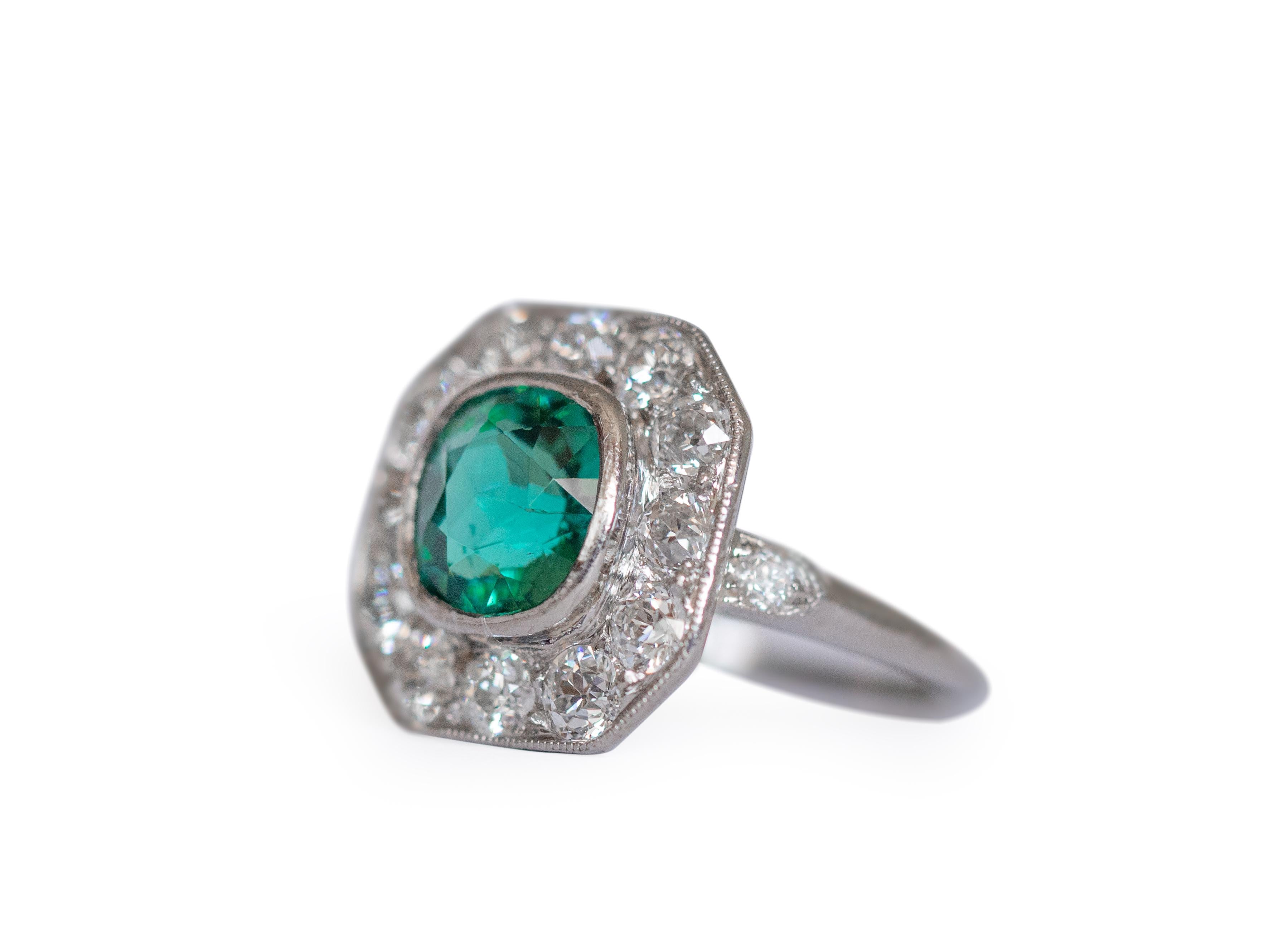 This is a gorgeous example of an Art Deco era tourmaline ring! The gorgeous antique cushion cut tourmaline is a fantastic shade of greenish-blue very similar to the coveted 