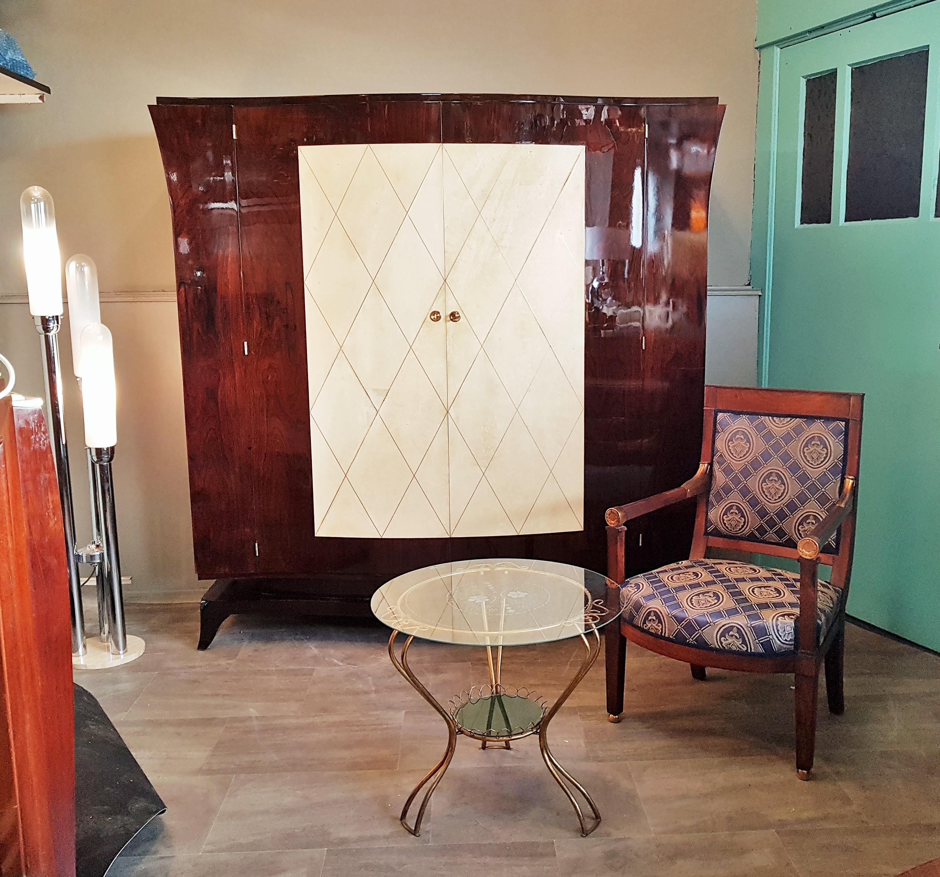 Art Deco Parchment Armoir wardrobe in the manner of Jean Pascaud, France, 1935.

Restored in high gloss lacquor, hand polished. Parchment in good vintage condition. Brass ornamets.