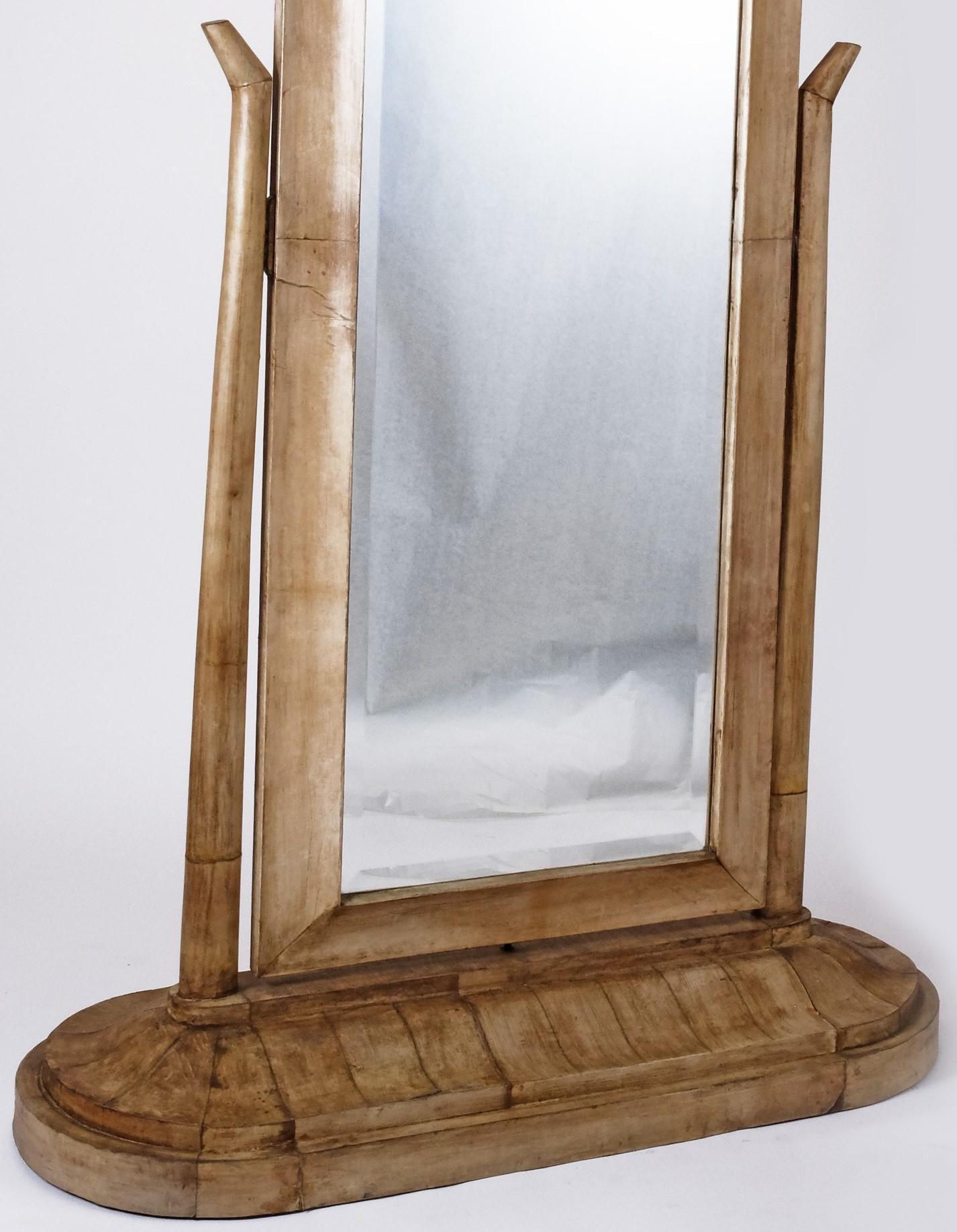 Art Deco parchment free standing mirror. Circa, 1920's. The back of the piece is also in parchment finish, in its entirety.

The mirror pivots and stands on a wide base providing total stability. This is a wonderful example of the style and