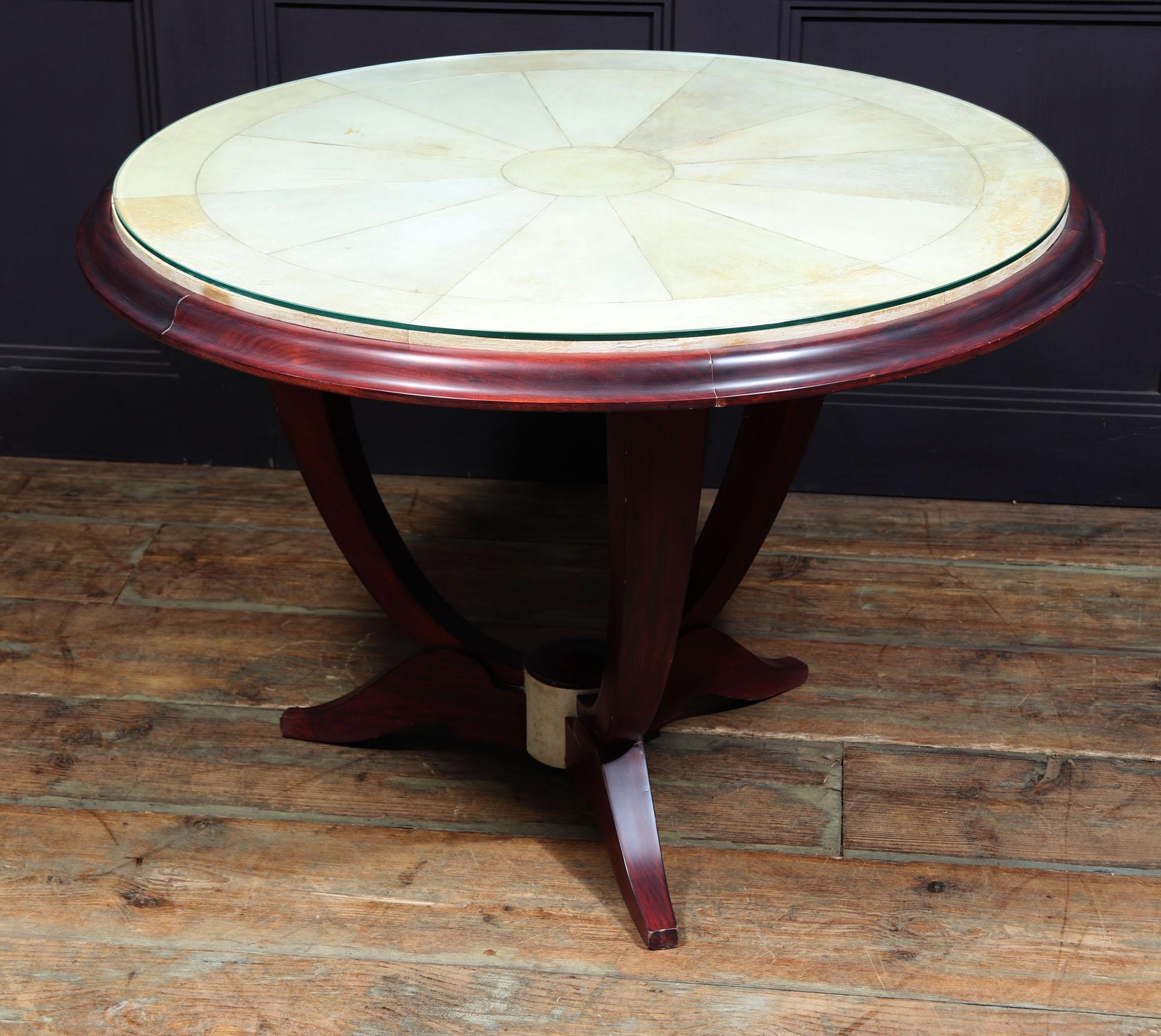 PARCHMENT TOP COFFEE TABLE - ART DECO 
A French Art Deco coffee table with solid mahogany frame with gentle u shape, standing on ornate tripod base, the centre of the base is covered in parchment to match the top that is segmented parchment with