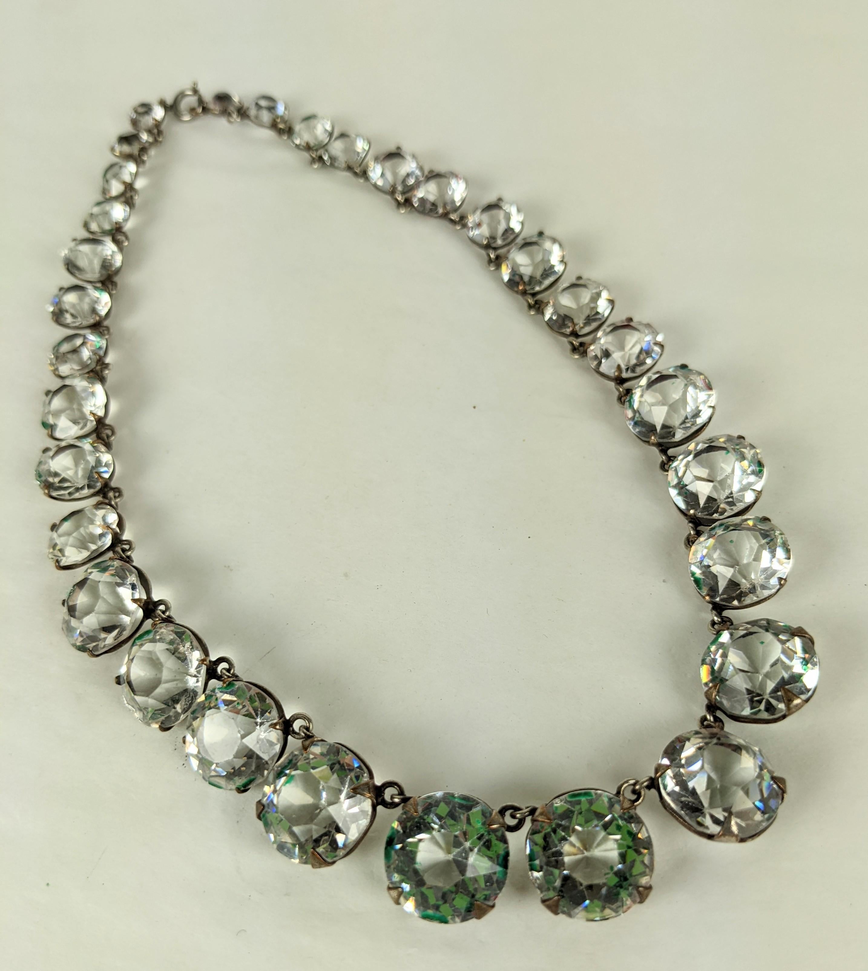 Attractive Art Deco Paste Graduated Crystals from the 1920's. Faceted lead crystal sparkles brightly in this riviere style. This probably had an emerald stain at one point and there are little hints of green left which is not terribly noticeable.