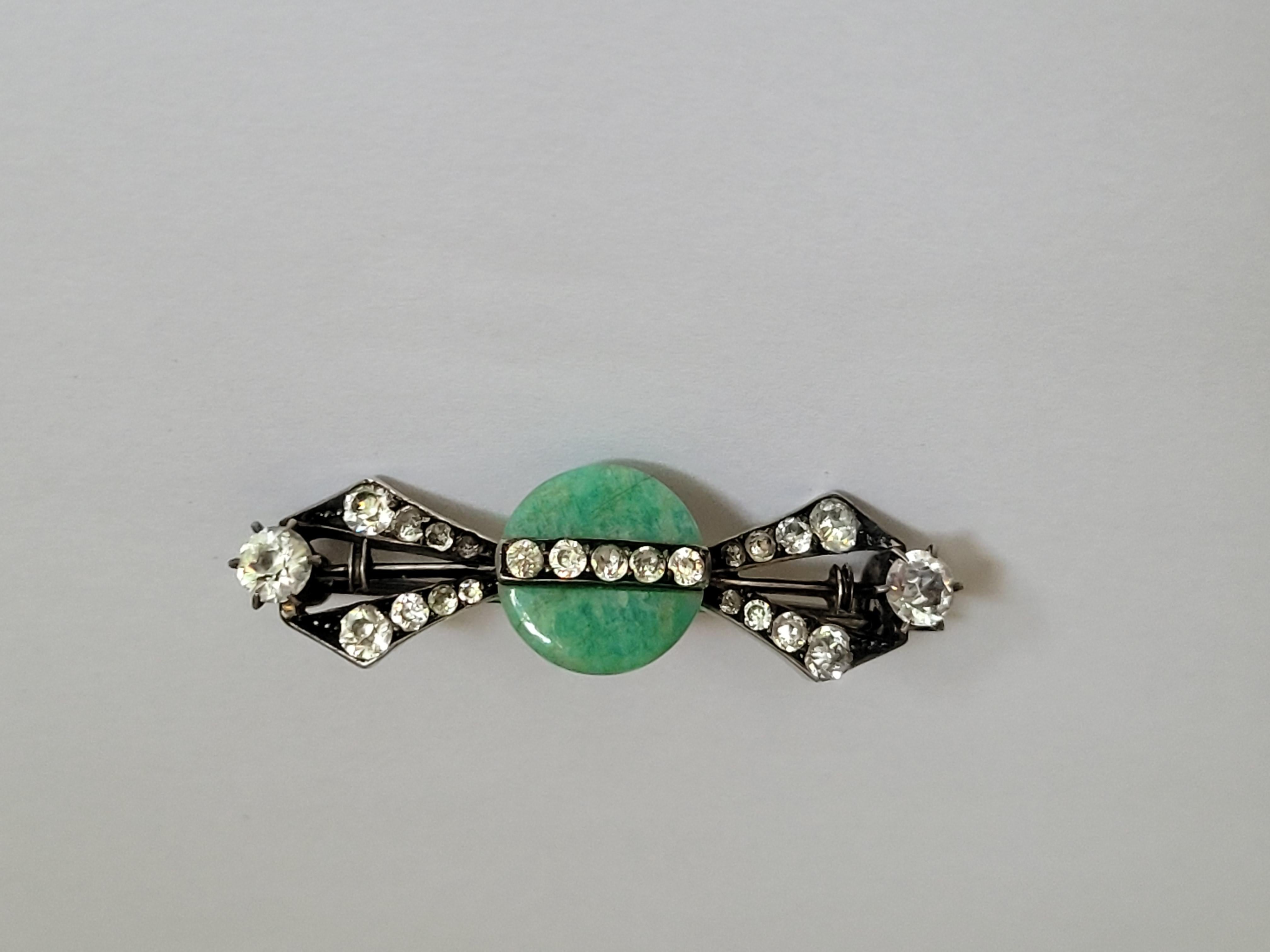 A Beautiful Art Deco c.1920s/30s Sterling Silver, Pecking glass and Paste brooch. Rare to find! 
Length 42mm, height 12mm.
Marked: Sterl.S. for Sterling Silver and F.W.H. maker mark. 
The brooch in good condition and ready to wear.
