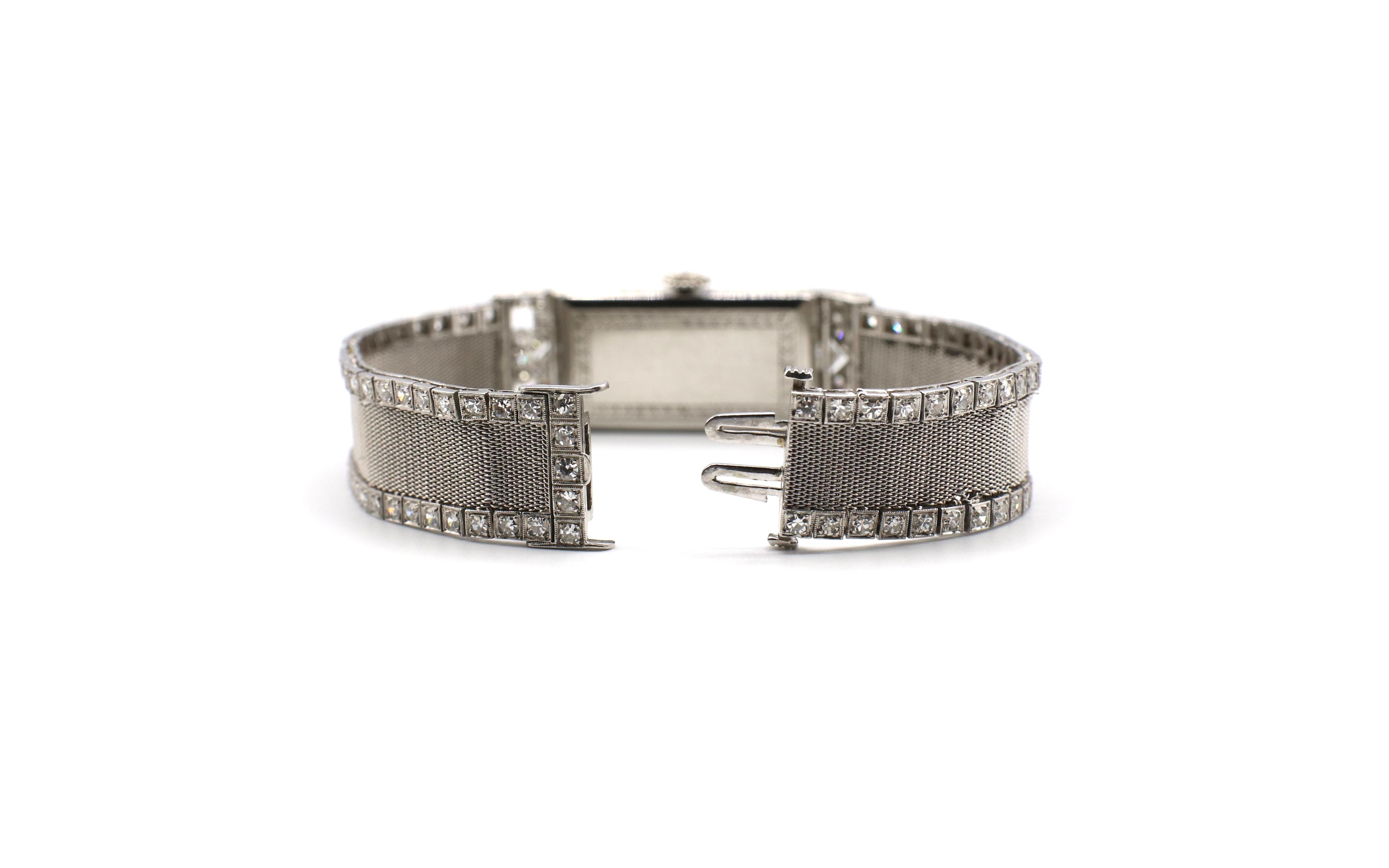 Antique Art Deco Patek Philippe platinum mesh diamond ladies dress watch.

Weight: 37.82 grams
Diamonds: 2 bullet shaped diamonds, approx. 1 ctw  G VS, 4 baguette diamonds, approx. 1 ctw G VS, 131 round single cut diamonds, approx. 1.25 ctw, G VS.