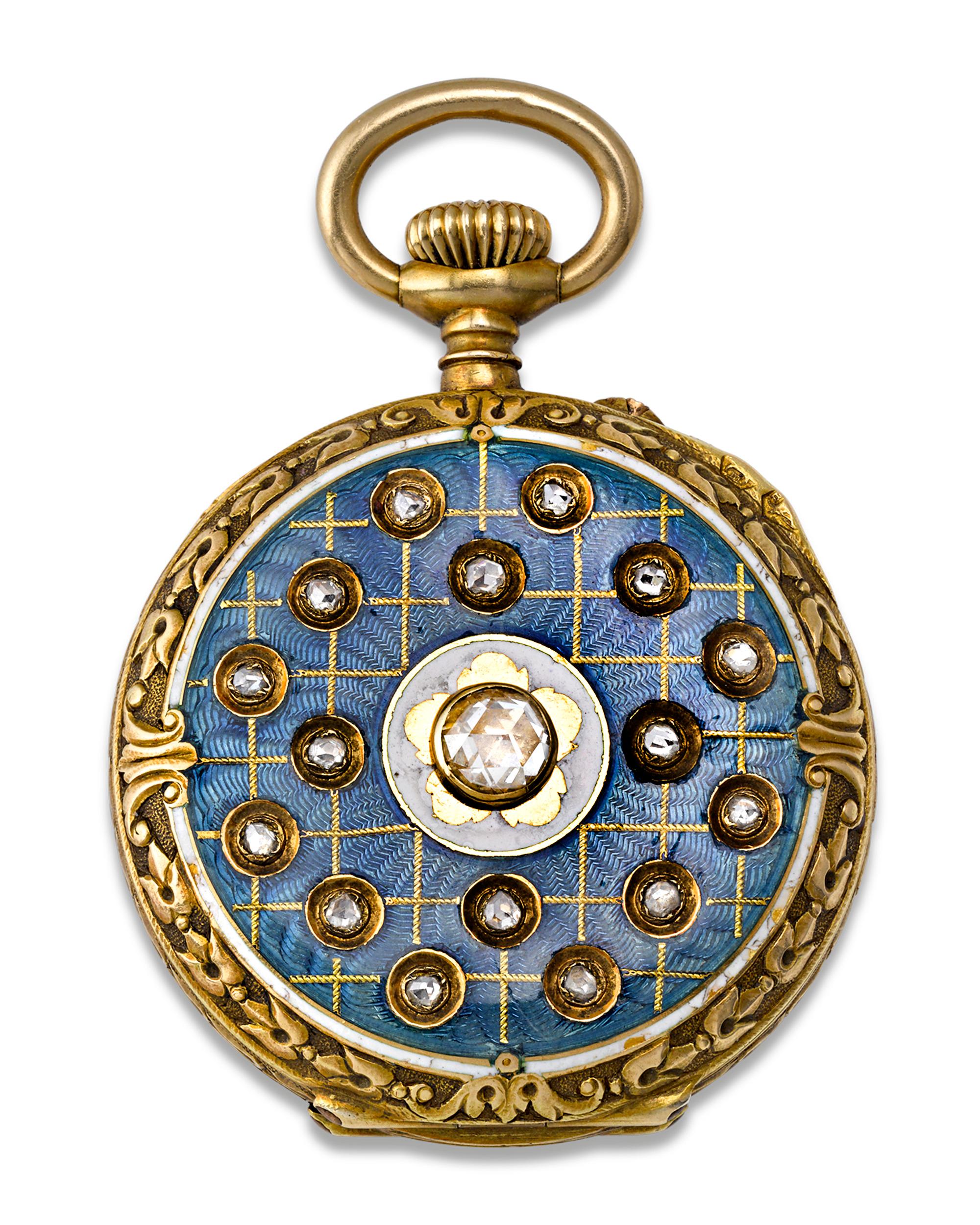 The world-famed Patek Philippe created this majestic pocket watch emphasizing elements of Art Deco in its design. The open-faced, bassine style case is crafted of 18K yellow gold with a marvelous engraved, organic motif surrounding the face. The