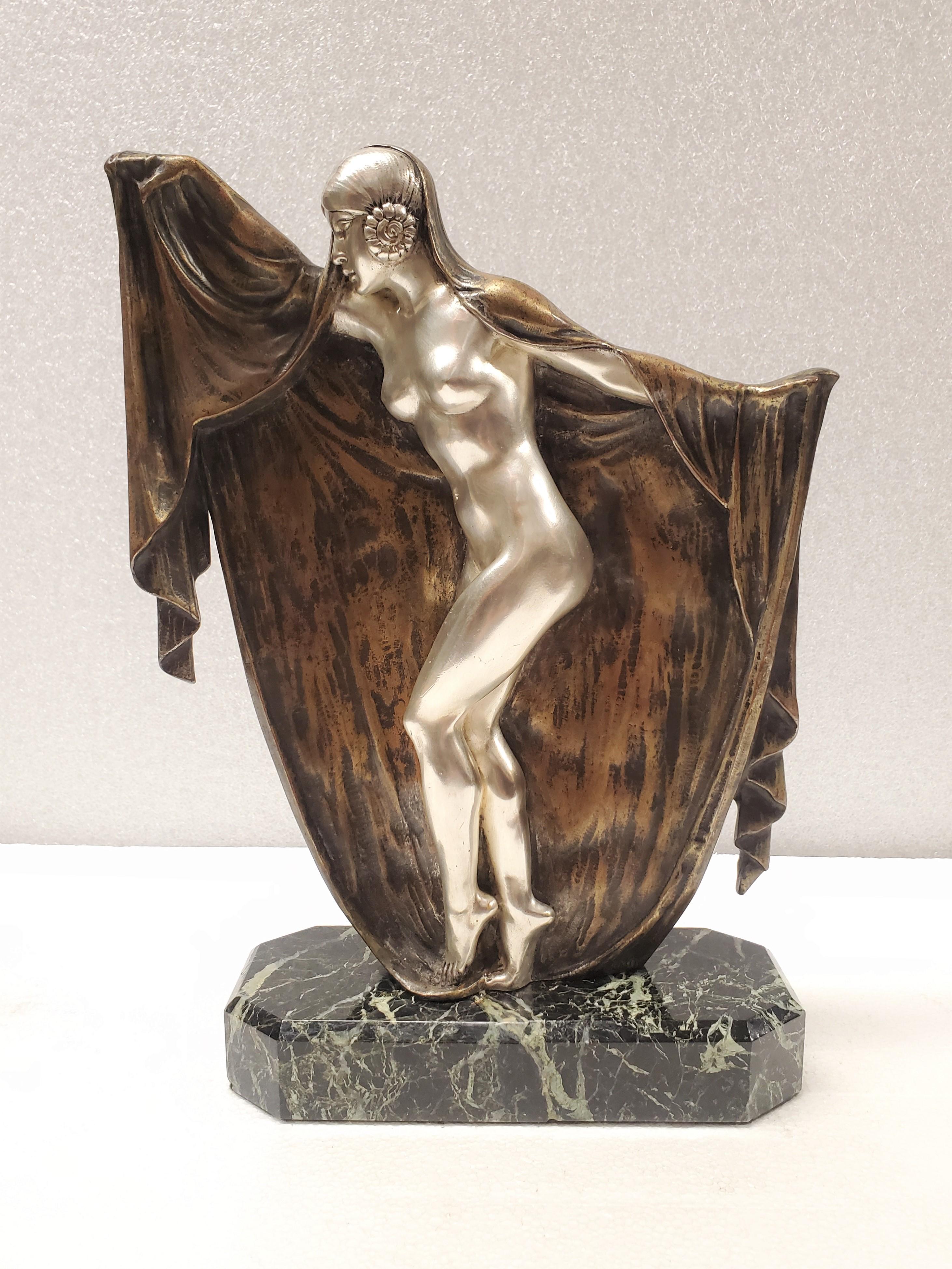 
 An original French Art Deco bronze sculpture of a nude dancer with a veil by Armand Lemo 1881-1936 
An exceptional and rare French Art Deco statue showcasing a polychrome figure of a gracefully draped female nude. The piece boasts a captivating