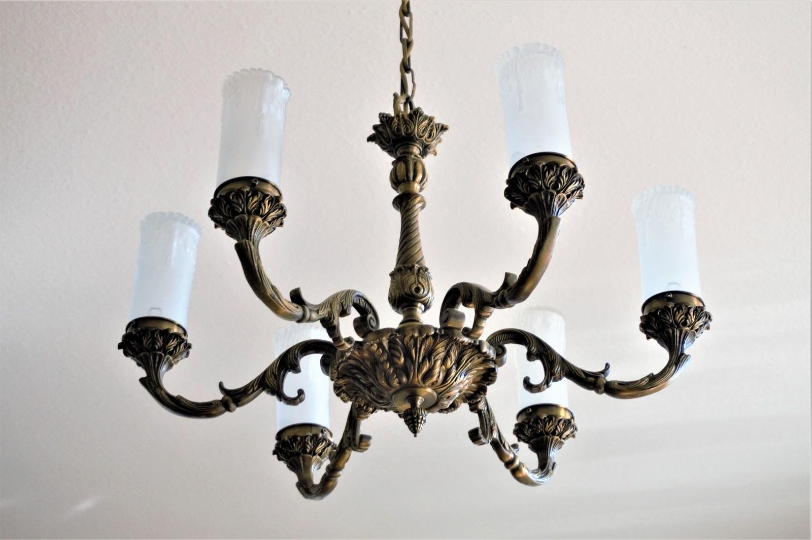Large Art Nouveau solid patinated bronze six-light chandelier with beautiful frosted glass candle shaped shades, France, 1910-1920.
Number of lights: Six E14 bulb sockets. Rewired and ready to hang.
Measures:
Height 42 in (107 cm)
Diameter 25 in