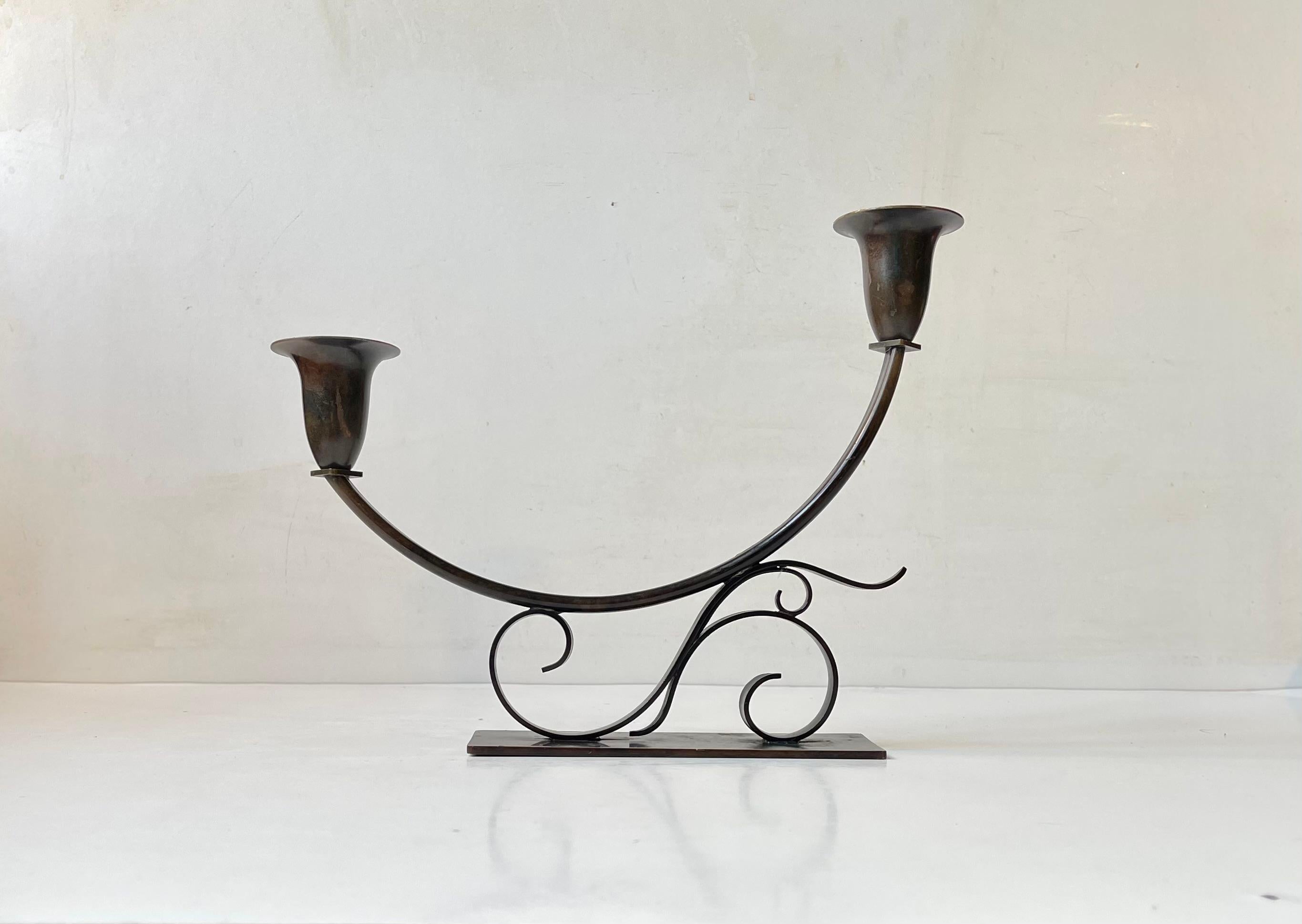 Stylized patinated bronze candelabra made by Holger Fredericia and manufactured in Denmark during the early 1930s. Art Nouveau inspired ornamentation. Brilliant for shallow interiors: mantle, window and hallway sills etc. Is to fitted with 2 regular