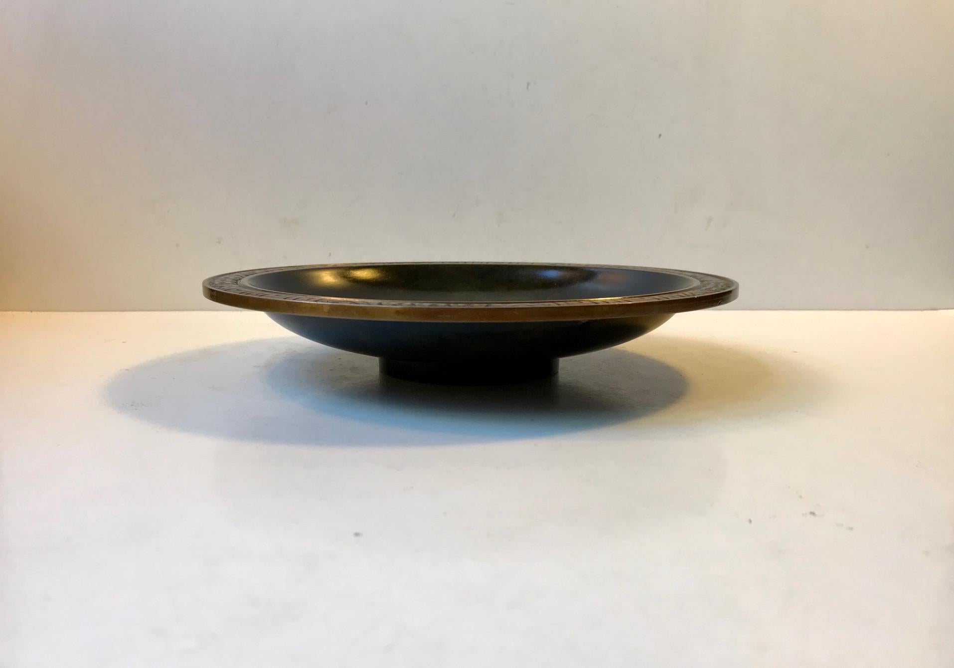 Thick and heavy low pedestal bronze bowl with green verdigris patina. Designed and manufactured by Krone Bronce (Crown Bronze) in Denmark during the 1920s. This manufacturer was supplier to the Royal Danish Court and the quality is superior to