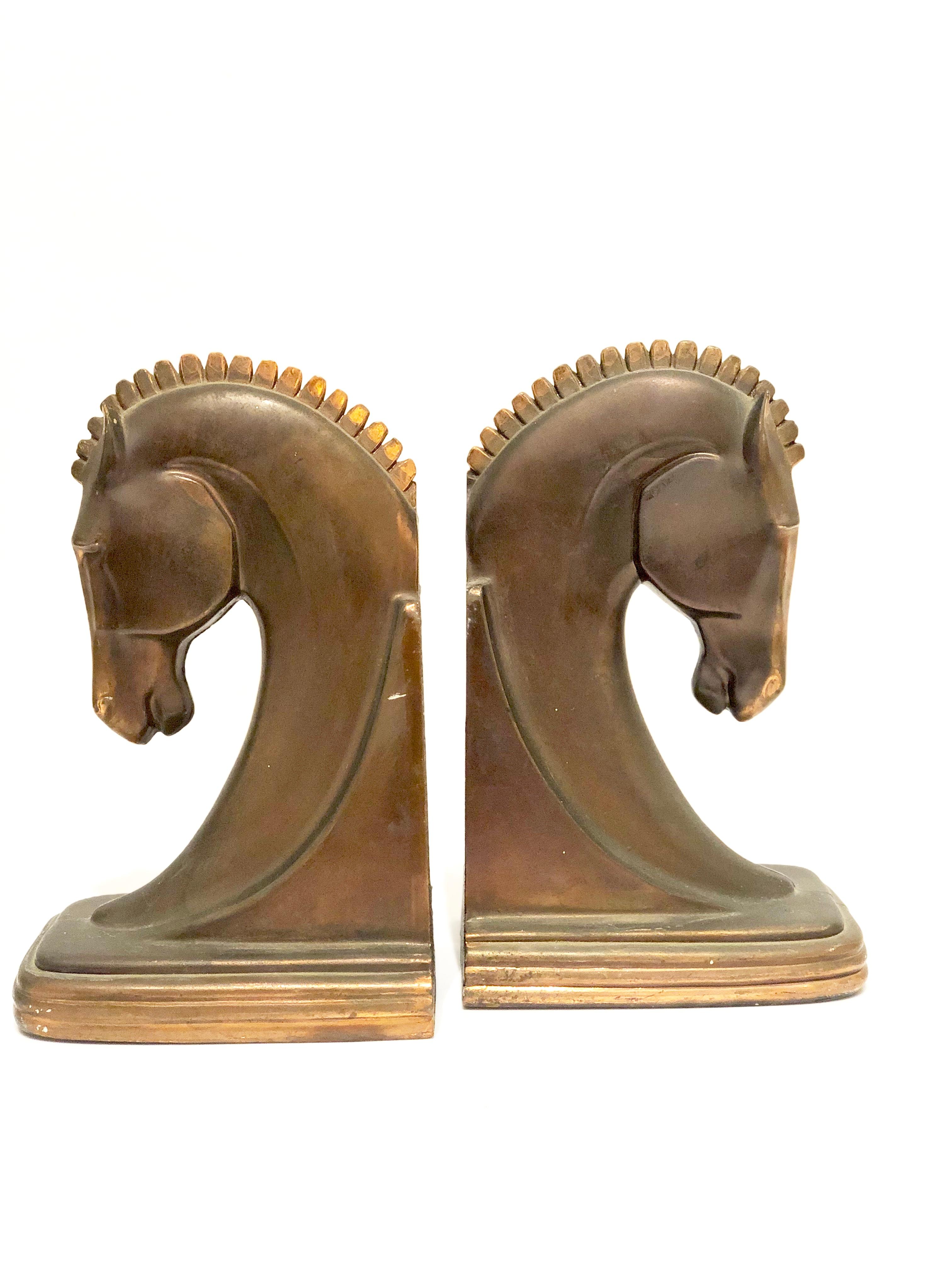 Beautiful and rare pair of bookends in original patinated bronze finish, the pair can be polished but we are selling them in its original finish and patina.