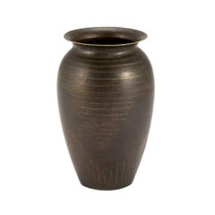 Vase Dinanderie patiné Art Déco de Jean Dunand