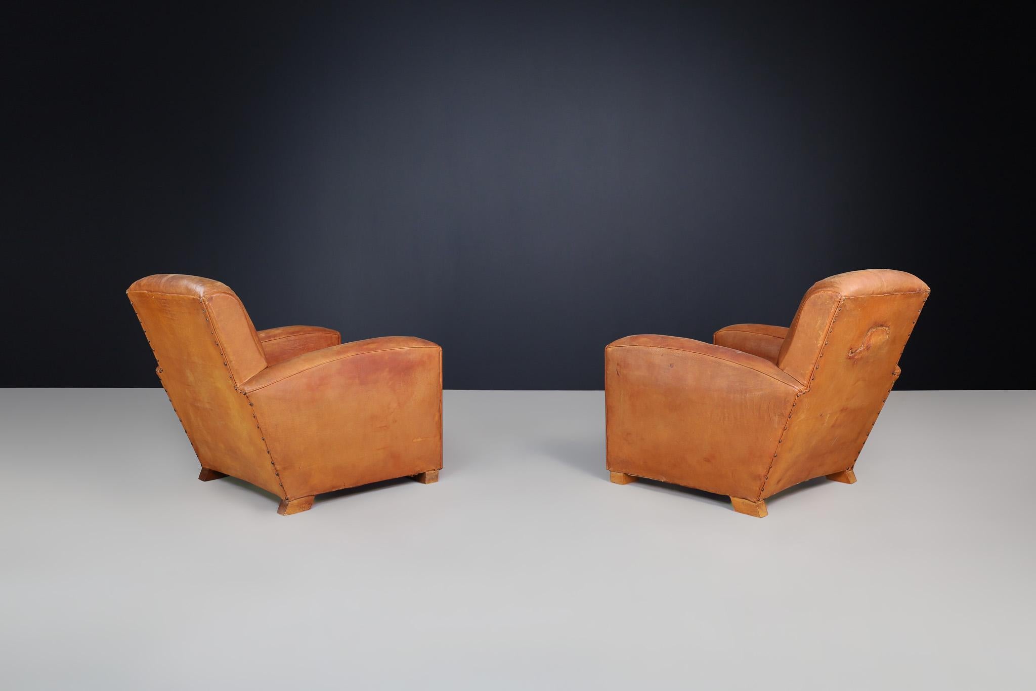 Mid-20th Century Art Deco Patinated Leather Lounge Chairs, France, 1940 For Sale