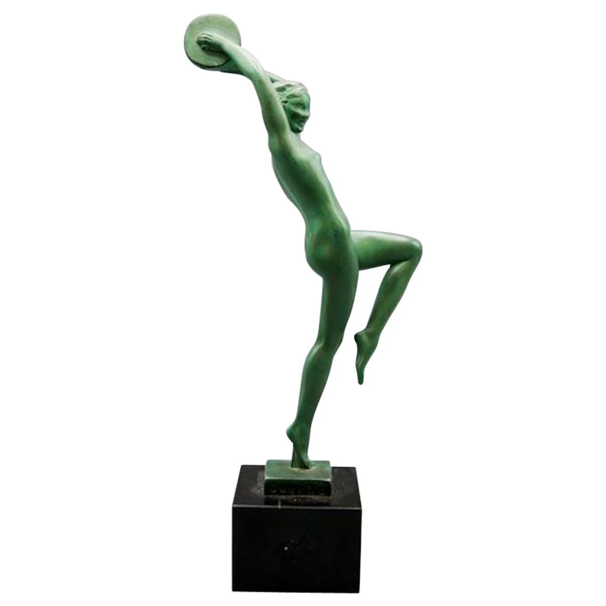 Sculpture de danseuse en métal patiné Art Déco sur socle en marbre noir par Raymonde Guerbe