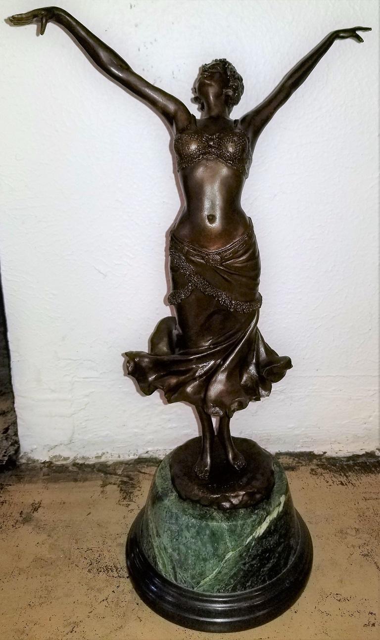 Presenting a gorgeous Art Deco Paul Philippe bronze lady dancer from circa 1925.

The bronze features a beautiful lady with outstretched arms and swirling skirt in classic Art Deco attire.

Beautiful detail to this bronze with natural