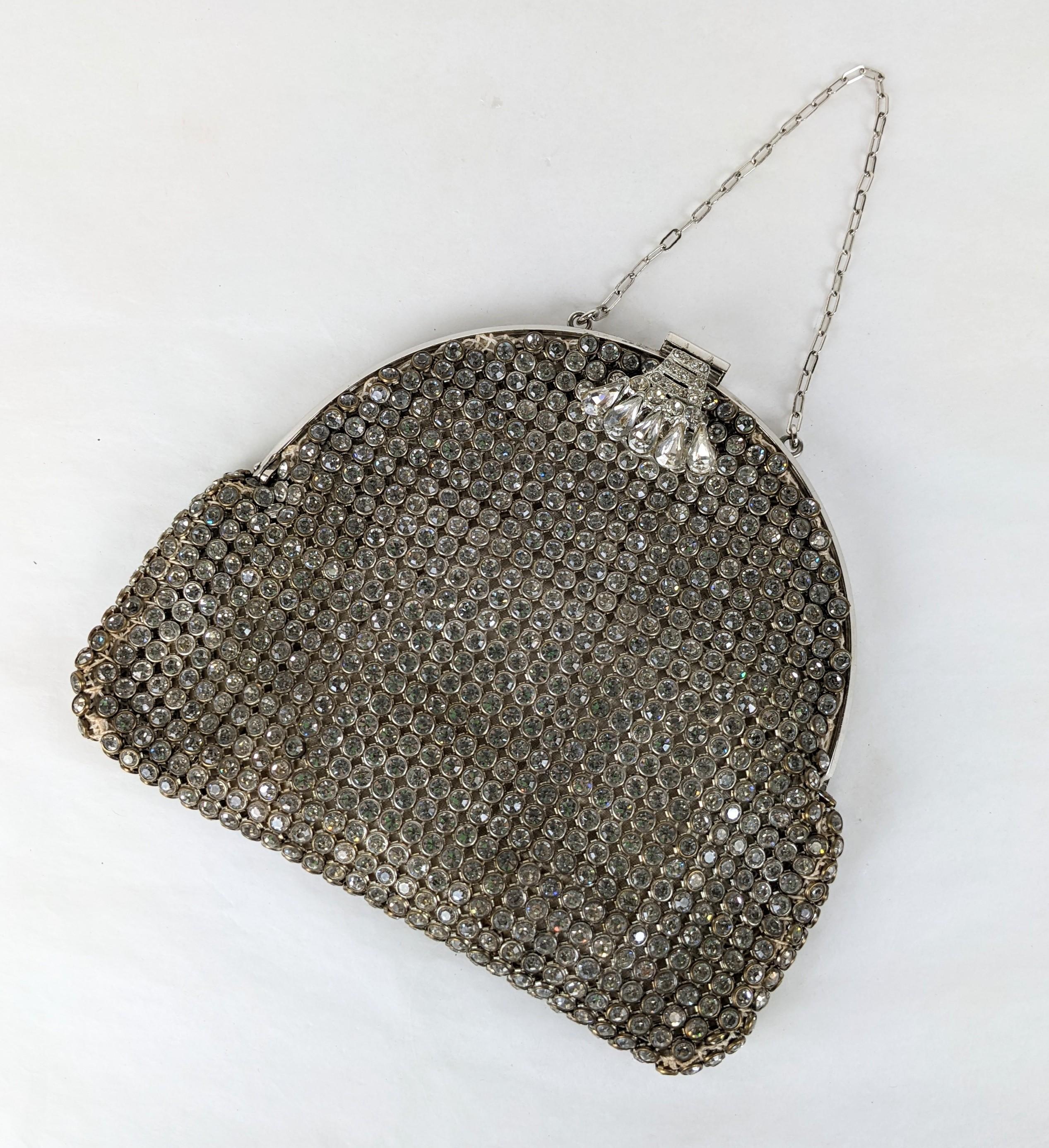 Art Deco Pave Rhinestone Bag from the 1930's. Fine quality with each stone set into a metal bezel attached to a cotton mesh ground. Rounded edge with delicate chain handle and satin lining. Clasp set with pear shaped crystals. 5