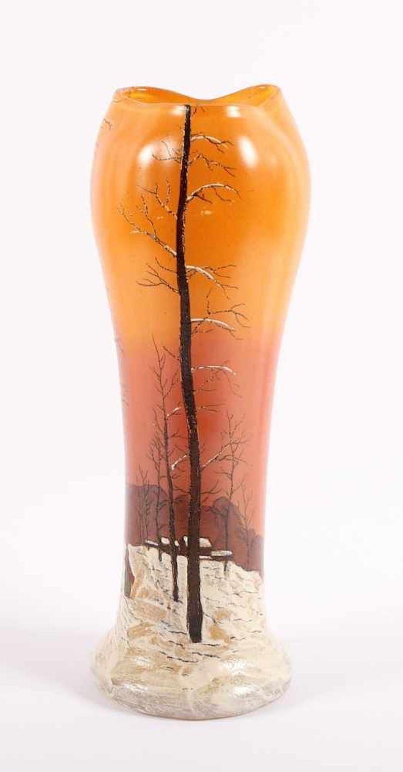 Paysage de Neige vase is an original decorative object realized in the 1920s by François-Théodore Legras.

This very precious and rare vase orange-colored with a winter landscape decoration in polychrome enamel painting and black plumb line.