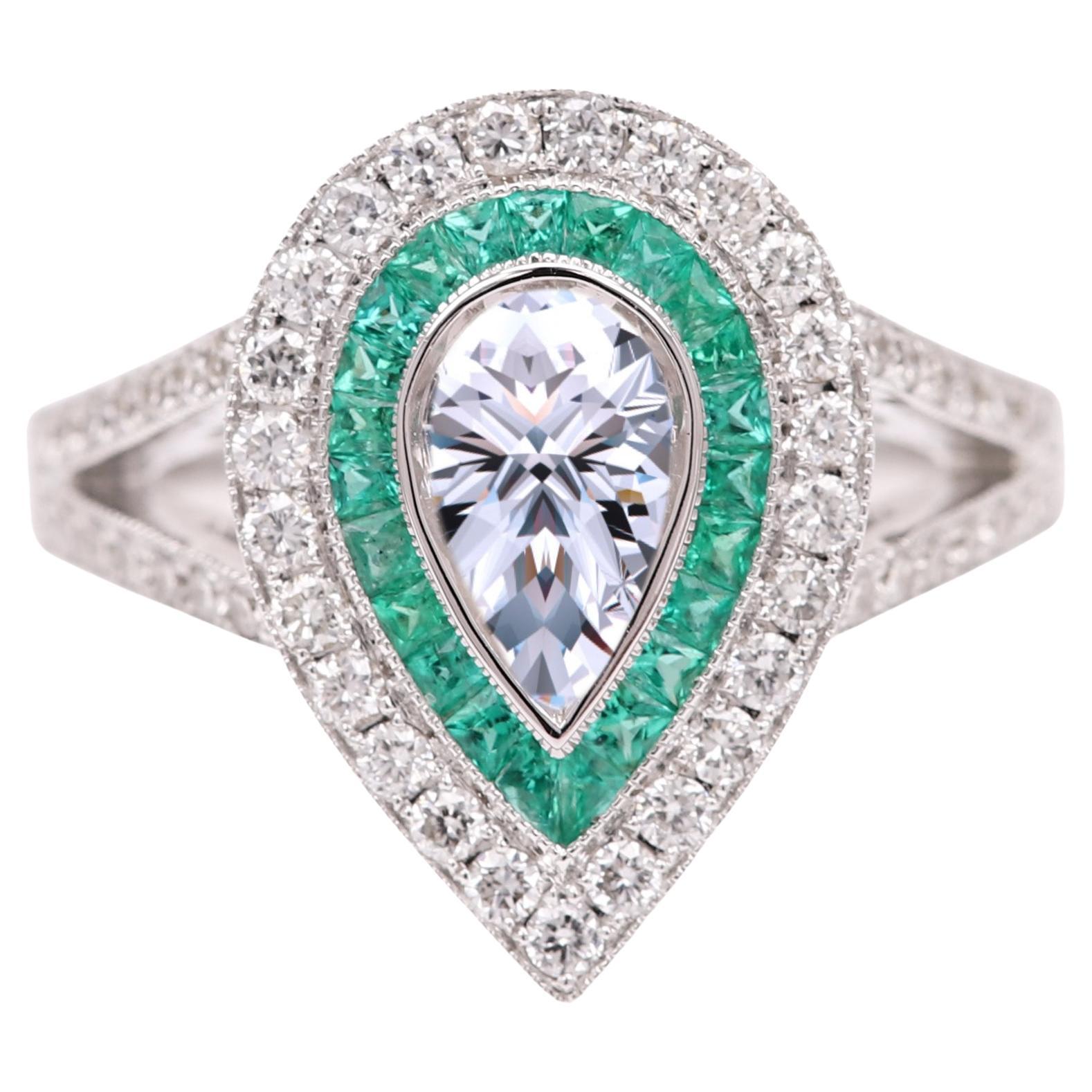 Art Deco Birnenförmiger Diamant GIA 0,70 Karat und Smaragd in 18 Karat Weißgold(