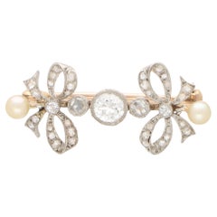 Art Deco Pearl and Old Cut Diamond Bow Pin Brooch in Platinum and Gold