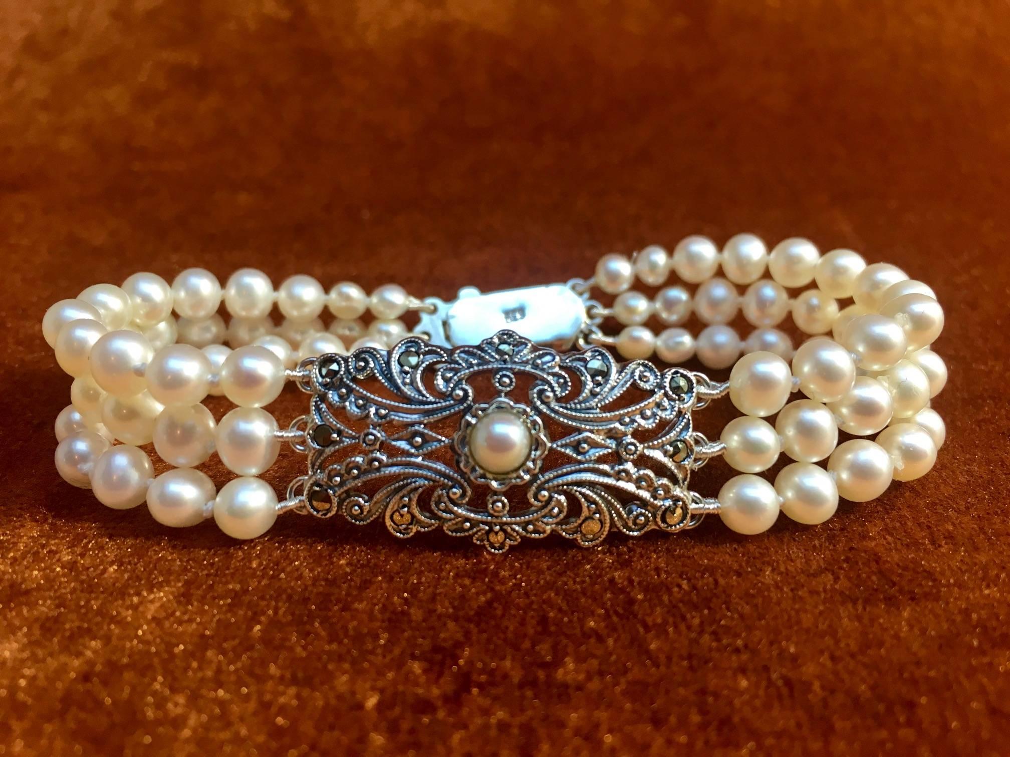 Pearl bracelet made from antique Art Deco brooche ornament set with pearl and marcasites. 

The original Art Deco brooche ornament has the old original hallmark of Austria.
The letter 