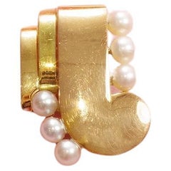 Art Deco pearl clip brooch in 18-karat rose and yellow gold, Cultured pearl