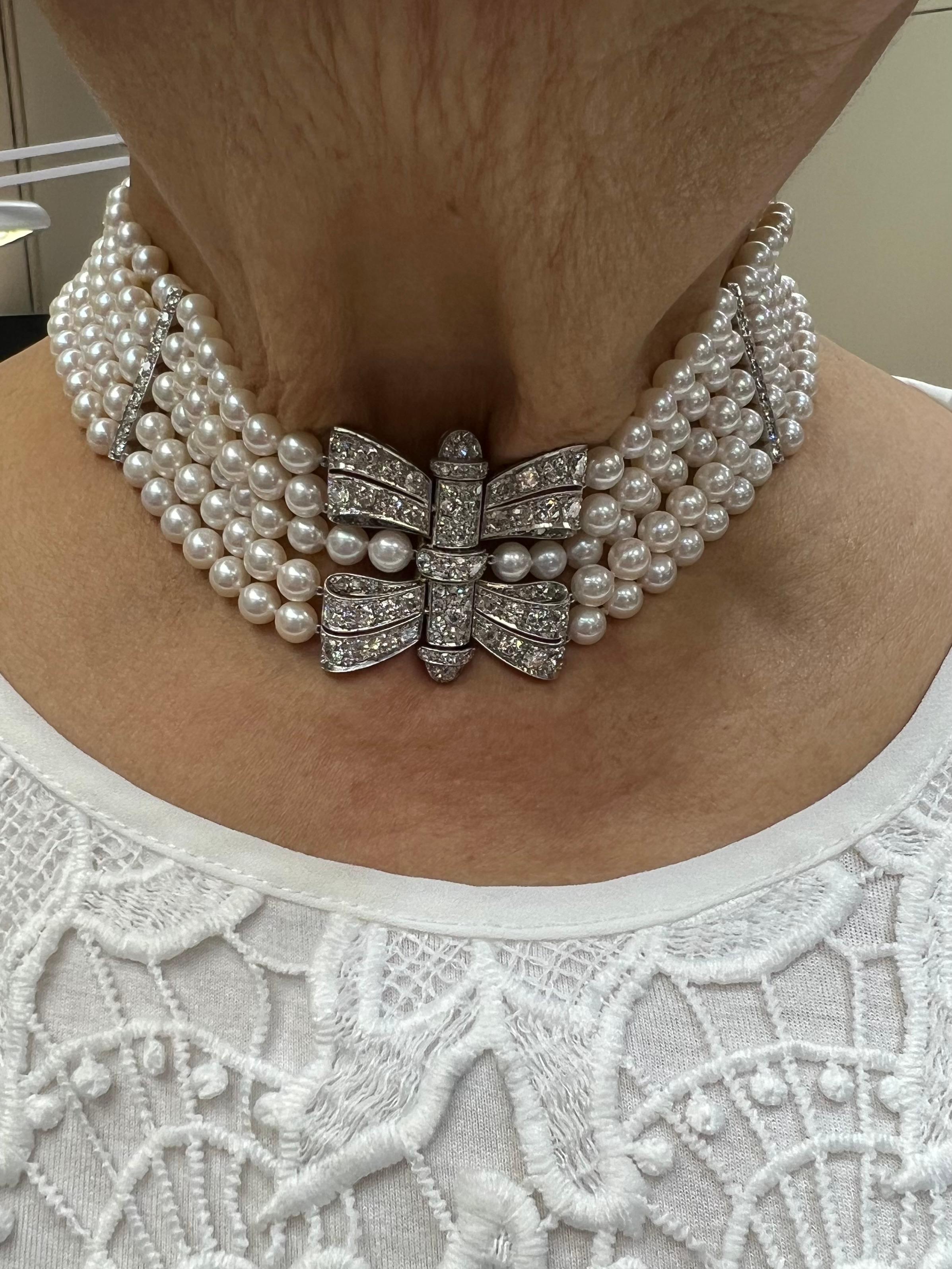 Art Deco Akoya Pearl diamond platinum choker collar necklace, circa 1930s.

The Art Deco Akoya Pearl Diamond Platinum Choker Necklace, crafted in the 1930s, epitomizes the elegance and sophistication characteristic of the Art Deco movement. This