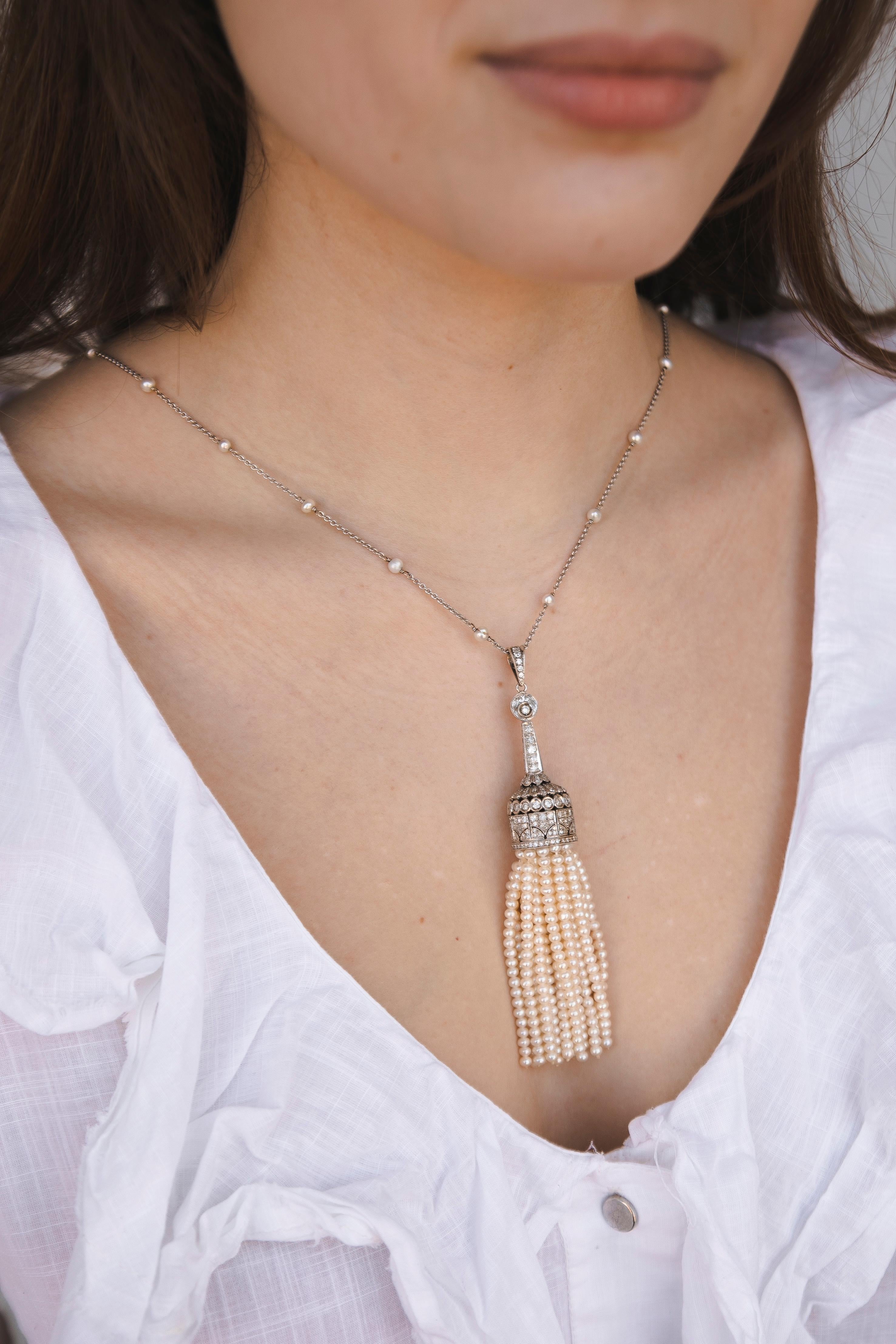 Pearls and Diamond Art Deco Tassel Necklace White Gold 18K. Really long and stylish chain is composed of alternating nature Pearls. The base of the tassel is covered with Diamonds on all sides. The work of the jeweler is just outstanding. 
The fine