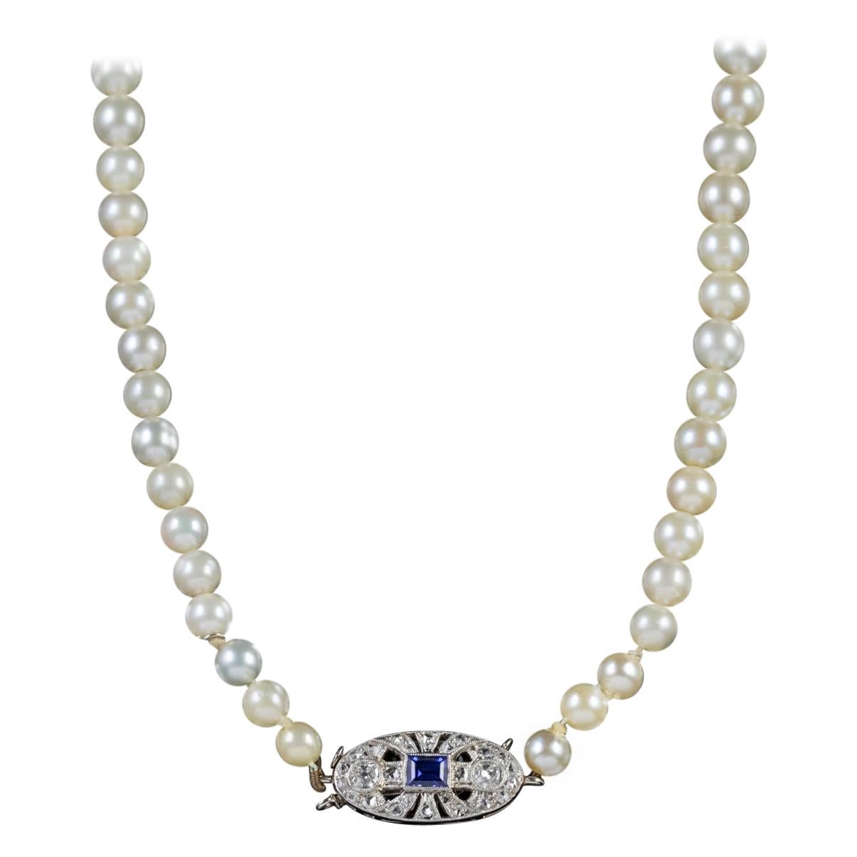 Art Deco Pearl Necklace Sapphire Diamond Platinum Clasp, circa 1930 For Sale