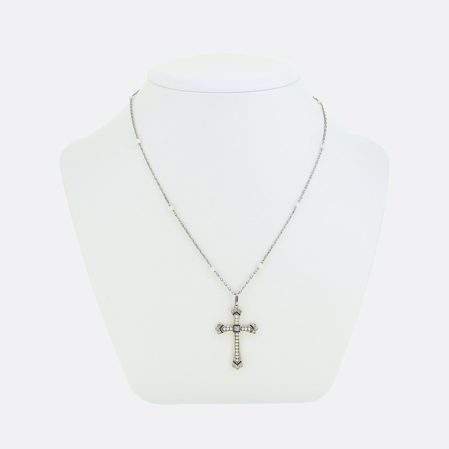 Here we have a truly wonderful cross that dates back to the Art Deco era. The cross is crafted in in 18ct yellow gold and platinum and features, pearls, calibrated sapphires and rose cut diamonds. It sits on an elegant platinum pearl chain that