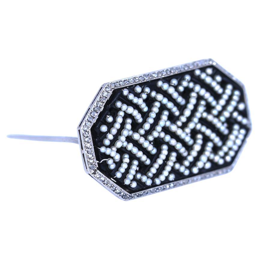 A very rare example of the British jewelry. Fine craftsmanship, very delicate work on Jet with tiny pearl seeds being arranged as a braid. Jet is a gemstone. Unlike many gemstones, jet is not a mineral.
It is derived from wood that has changed under