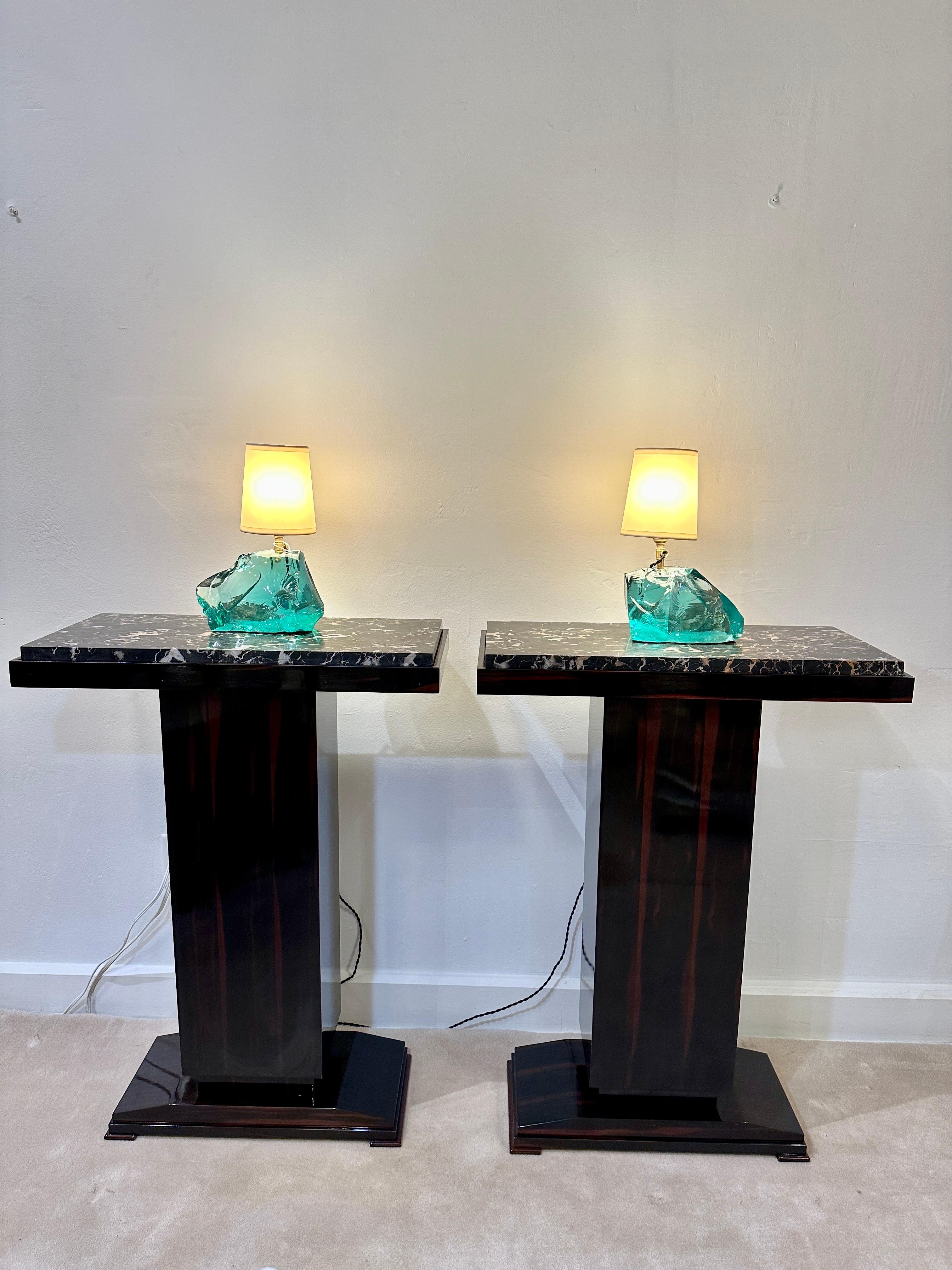 Thick Belgian black marble tops over macassar pedestal body, these pedestals are beautiful examples of Art Deco elegance and grandeur.  TWO available - priced and sold individually.