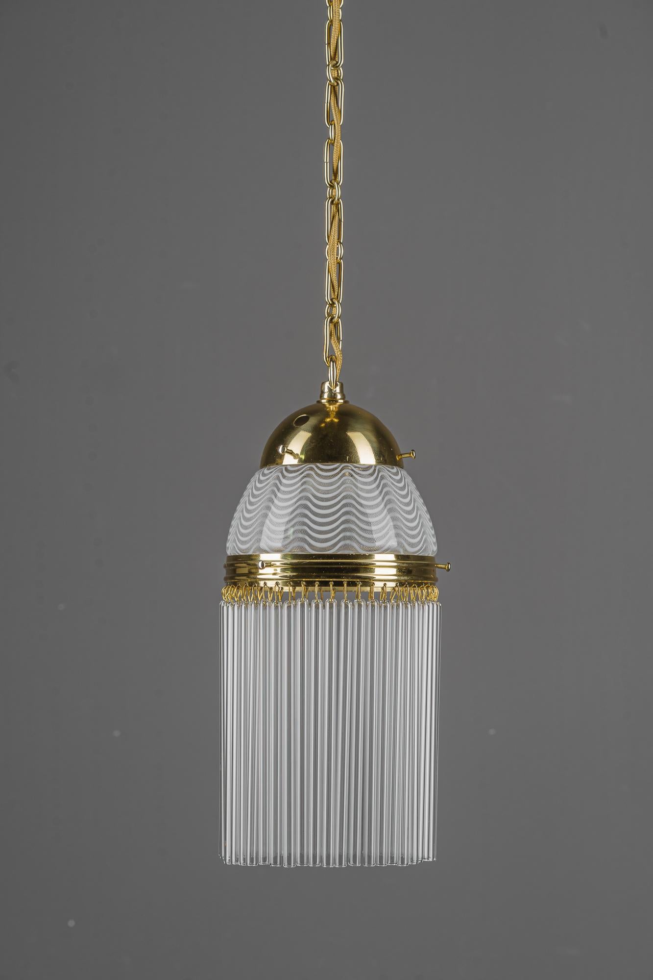 Art Deco pendant around 1920s with opaline glass shade vienna 1920s
Brass polished and stove enameled
Beautiful antique opaline glass shade
The glass sticks are replaced ( new )