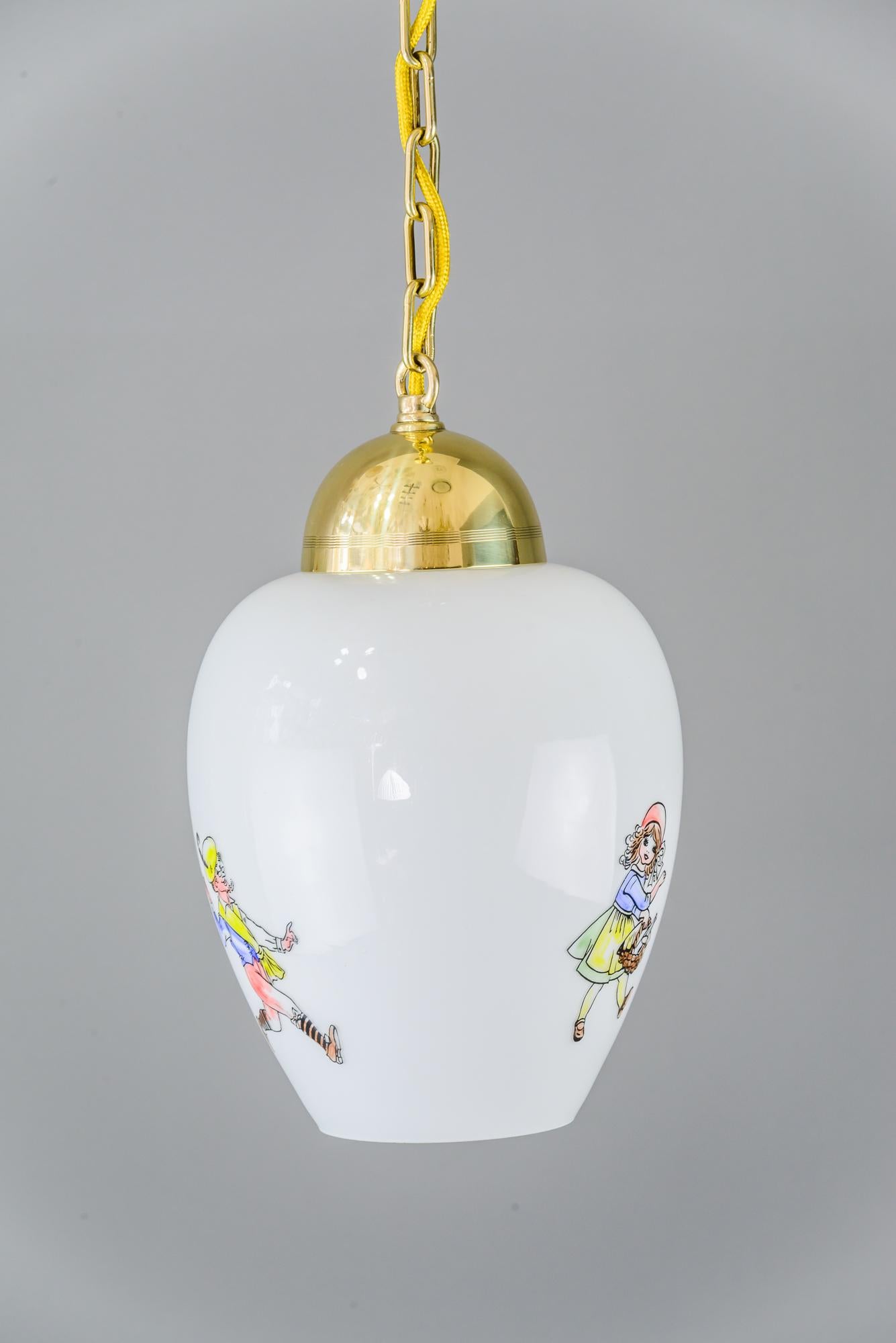 Art Deco pendant, circa 1930s
Polished and stove enamelled
Painted glass shade
3 different motives on the glass.