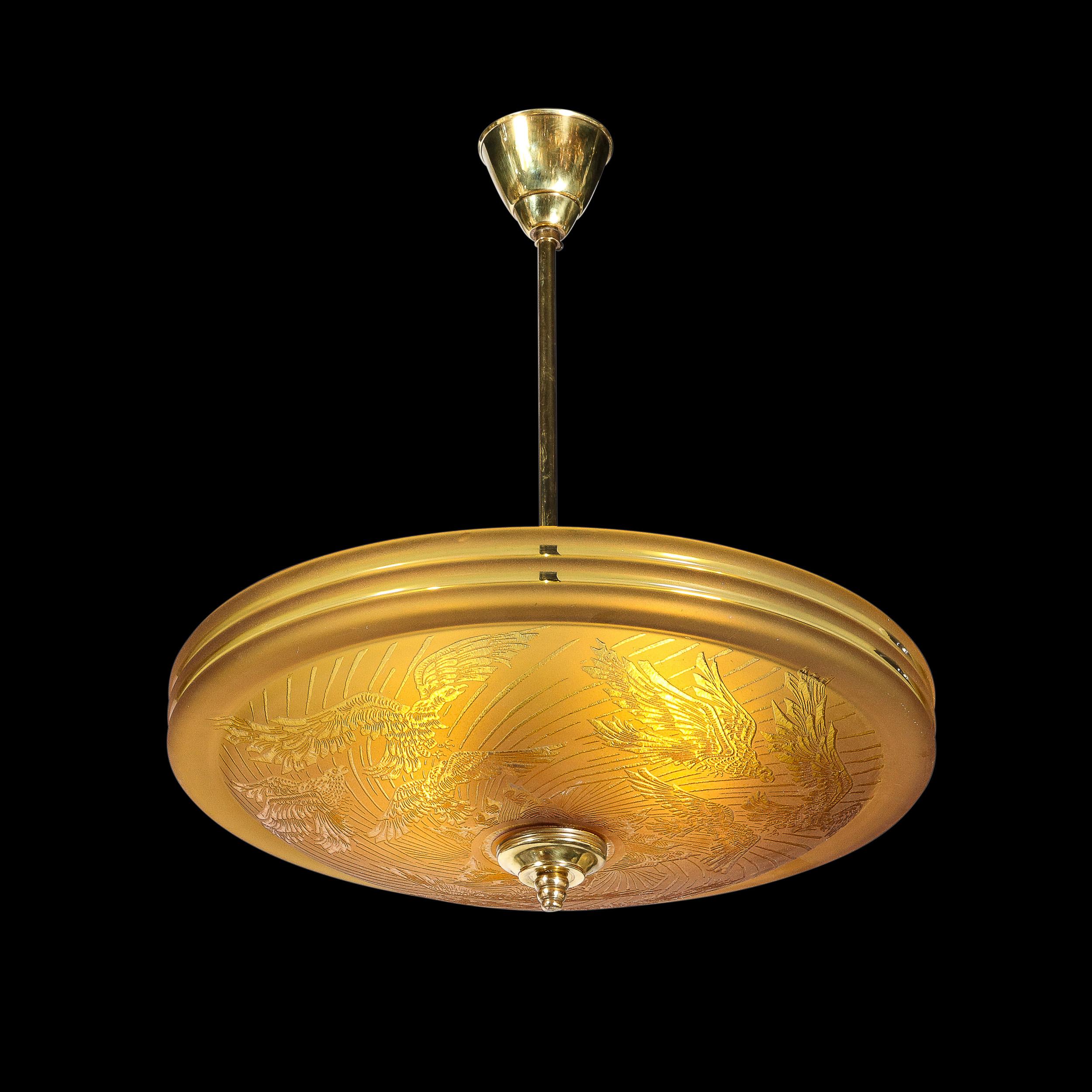 This striking Art Deco Pendant Chandelier with Acid Etched Detailing and bird Motifs is created by the company Deveau and originates from France, Circa 1925. In a single piece of beautiful Amber hued glass, a frosted glass finish is applied across