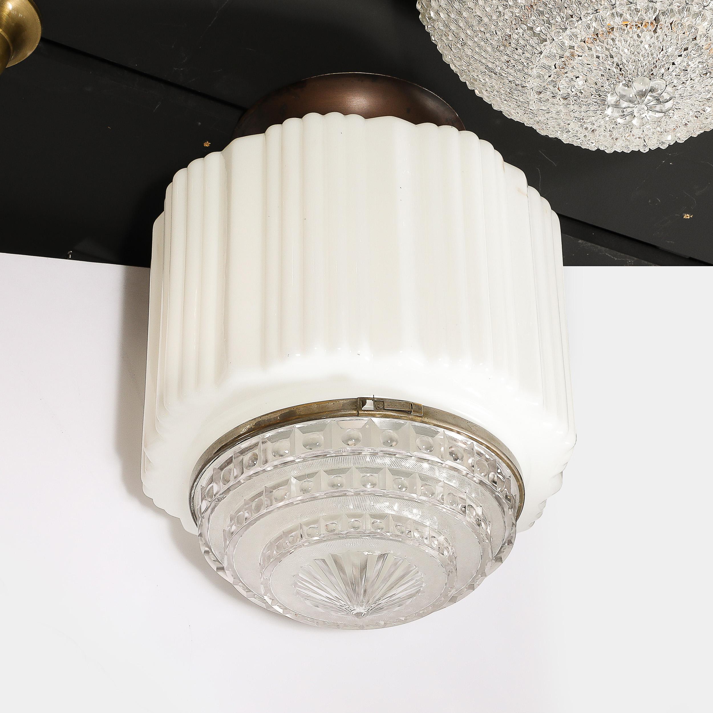 This powerfully scaled Art Deco Pendant Chandelier in Milk Glass with Oil Rubbed Bronze and Nickel Fittings originates from the United States, Circa 1930. Features a body composed in Milk Glass with fluted vertical striations leading to a bottom