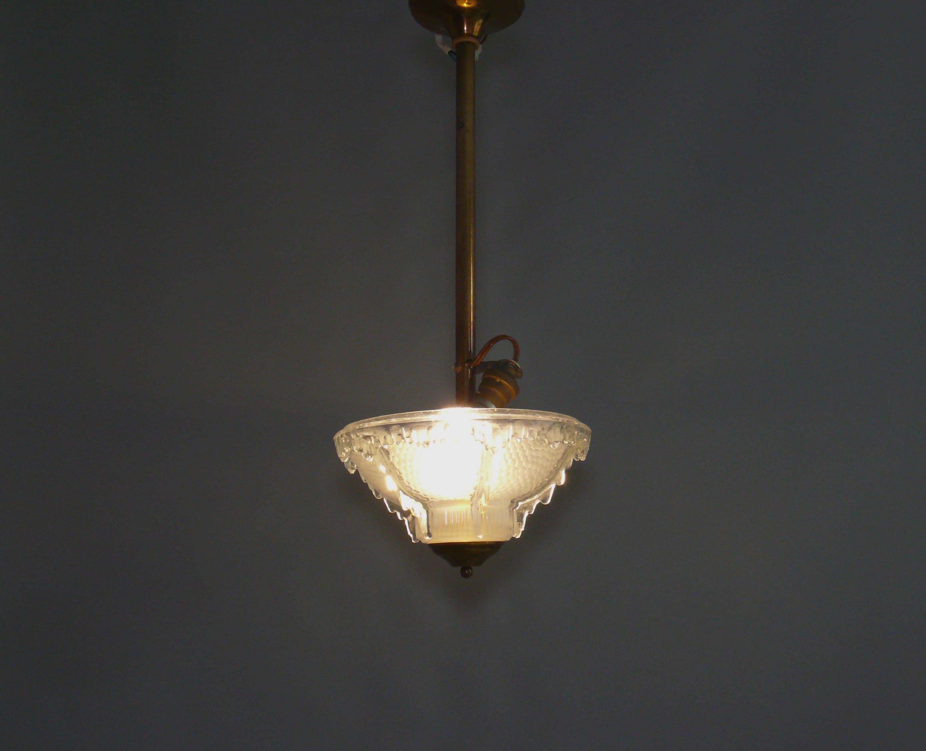 Ezan ceiling chandelier from France, 1920s - 1930s. Good condition, brass with visible signs of aging. The chandelier has a B22 bayonet socket as usual in France, the matching LED bulb is included*. Manufacturer's imprint on the glass rim EZAN -
