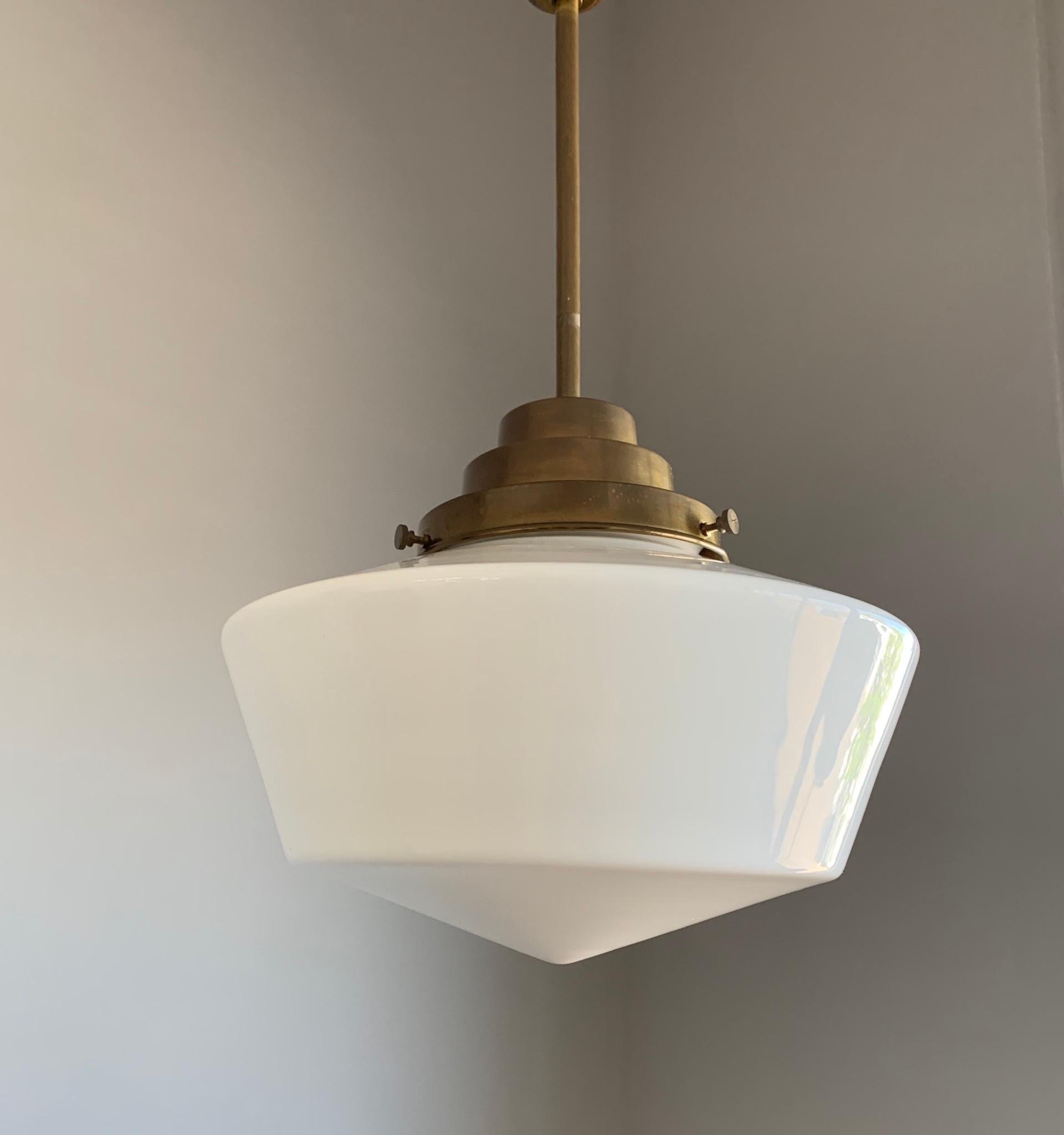 Beautiful shape and excellent condition pendant light. 

If you are looking for a beautiful and original antique pendant to grace your kitchen or bedroom then this timeless design could be perfect for you. The combination of the patinated brass and