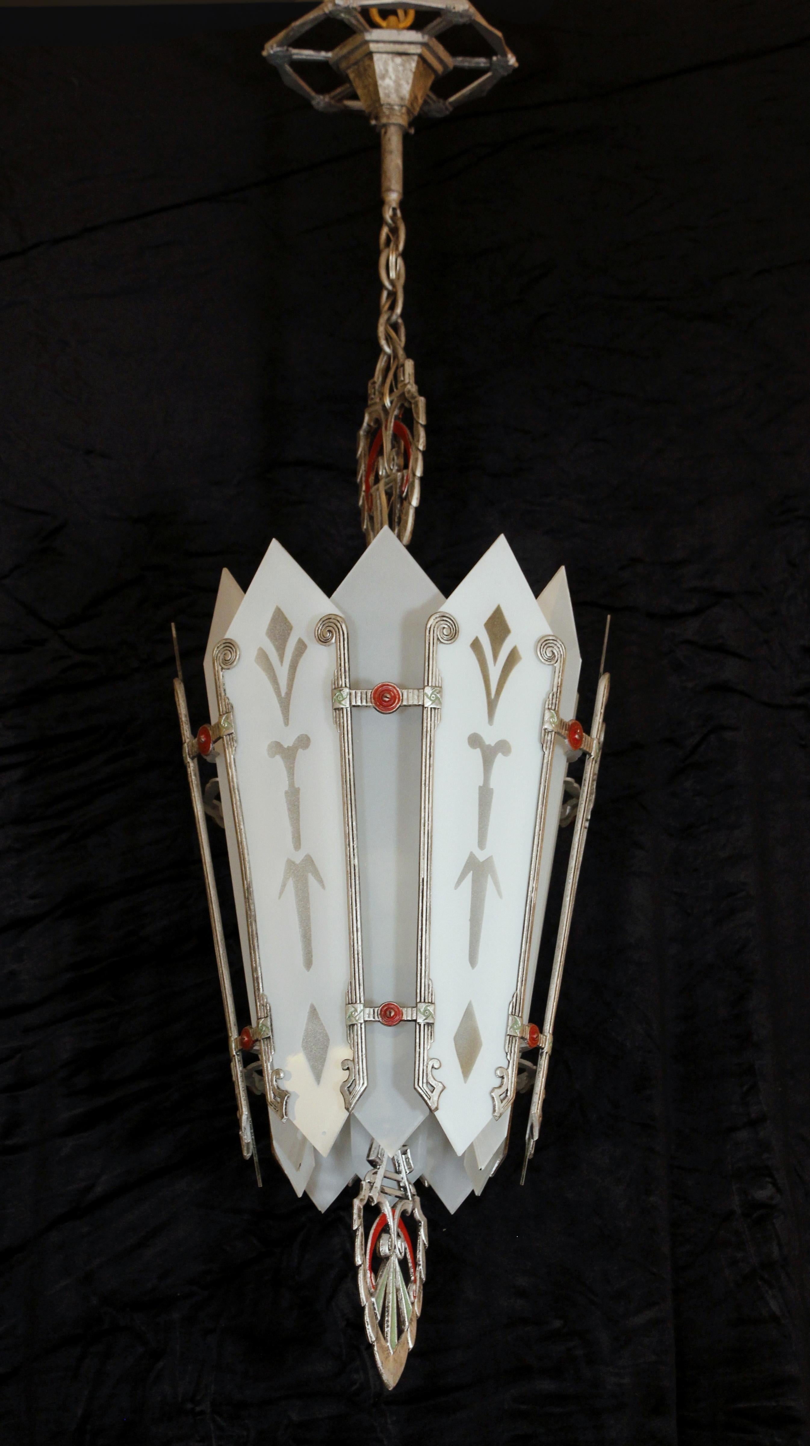 Retrieved from an establishment on the Shore Parkway in Brooklyn, NY. This original Art Deco pendant light comes with 6 rewired sockets and features the original etched glass shade panels. Polychrome aluminum frame. Please note, this item is located