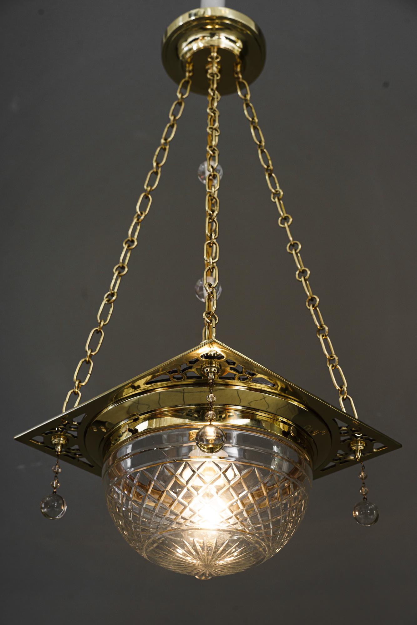 Art Deco Pendant with cut glass shade around 1920s
Brass polished and stove enamelled
Original cut glass shade.