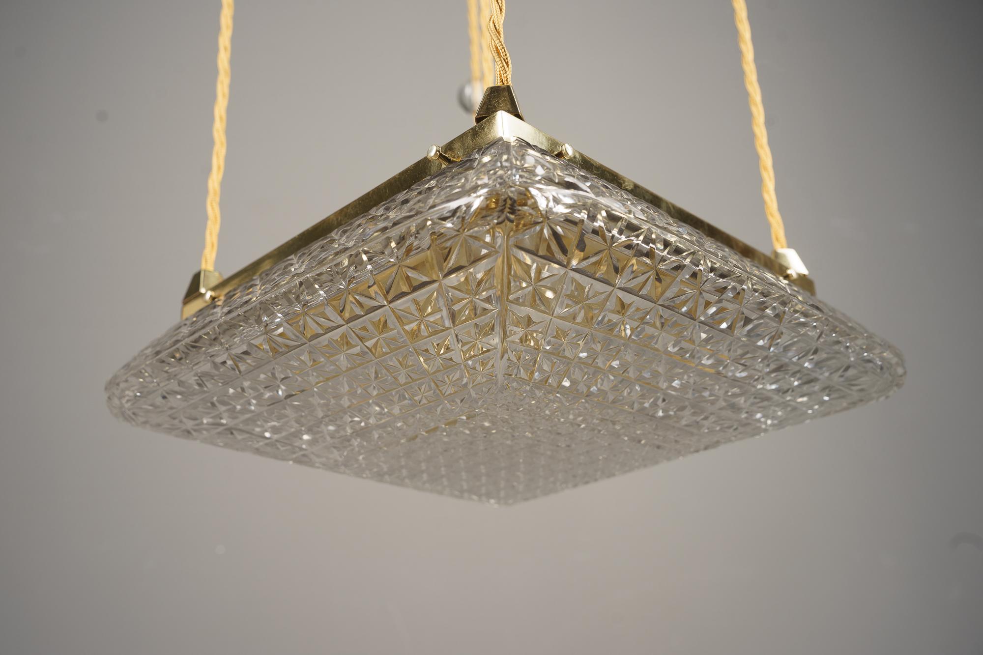 Brass Art Deco Pendant with cut glass shades vienna around 1920s For Sale