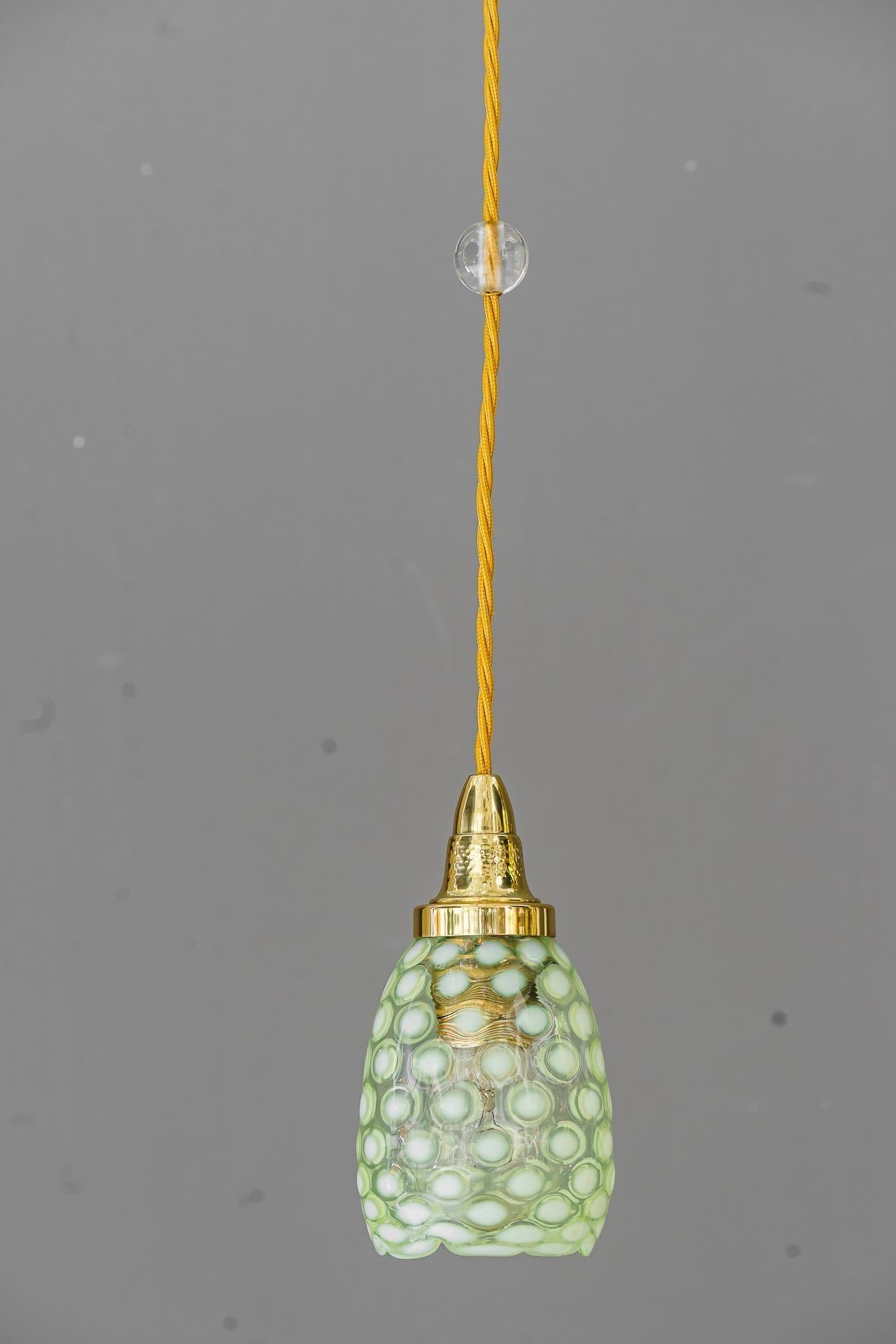 Art deco pendant with original antique opaline glass shade vienna around 1920s
Brass polished and stove enameled
We can adjust the hight of the lamp to fit your room hight
