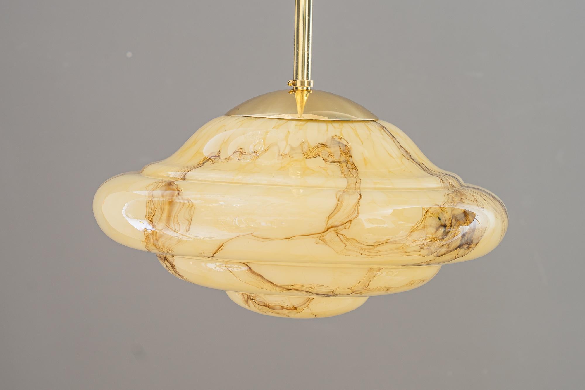 Art Deco pendant with original marbled glass vienna around 1930s
One bulb inside
Polished and stove enameled
Original glass shade