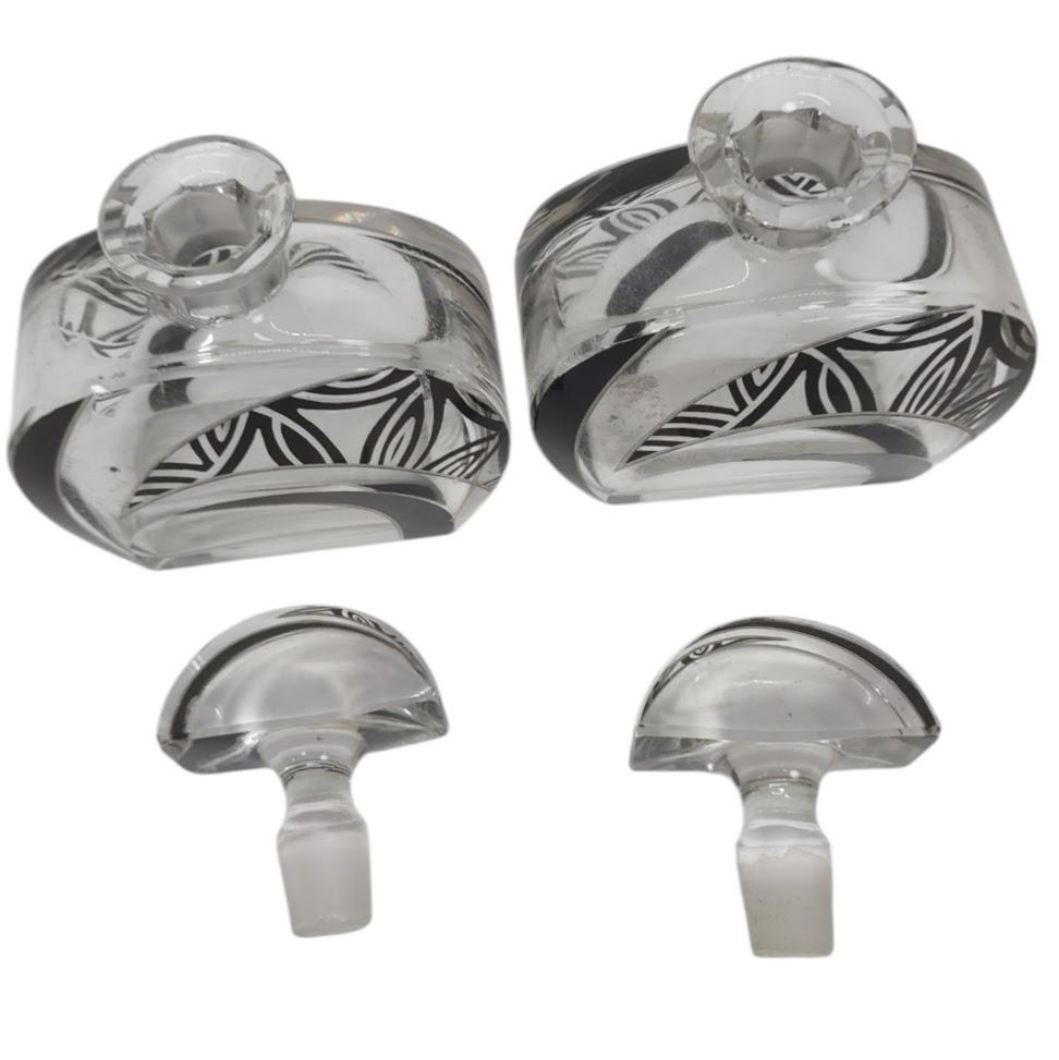 Cut and enamelled glass in asymmetrical geometric patterns of black, frosted white and clear glass.