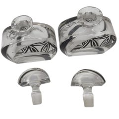 Art Deco perfume bottles in cut crystal, decorated with "flowers" black enamel